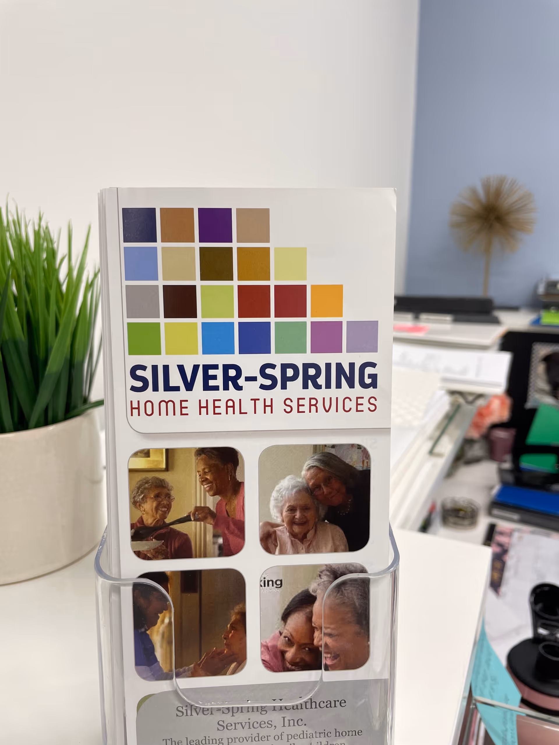 A Silver-Spring Home Health Services brochure on an office desk.