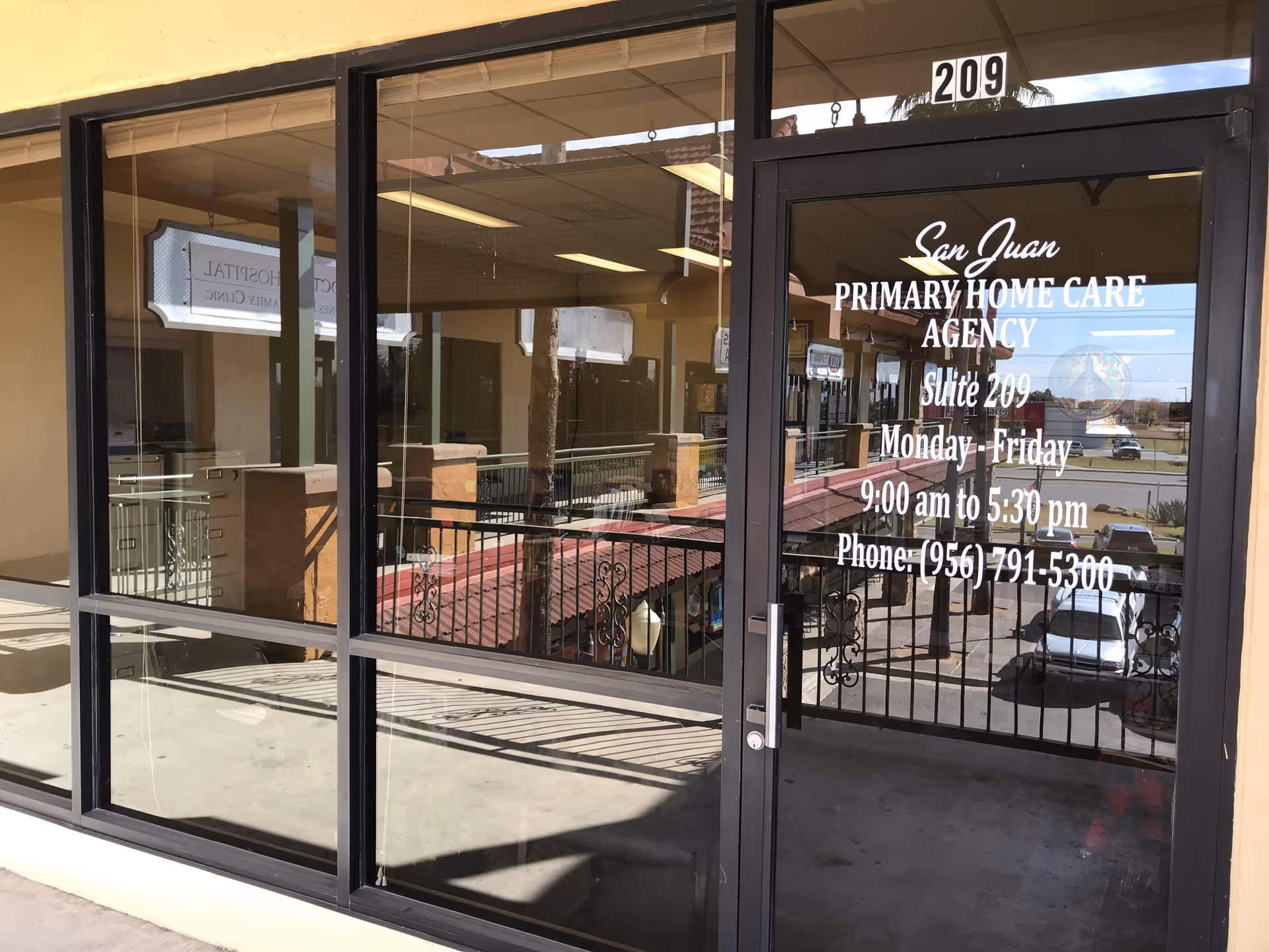 Glass storefront with San Juan Primary Home Care Agency signage and entrance.