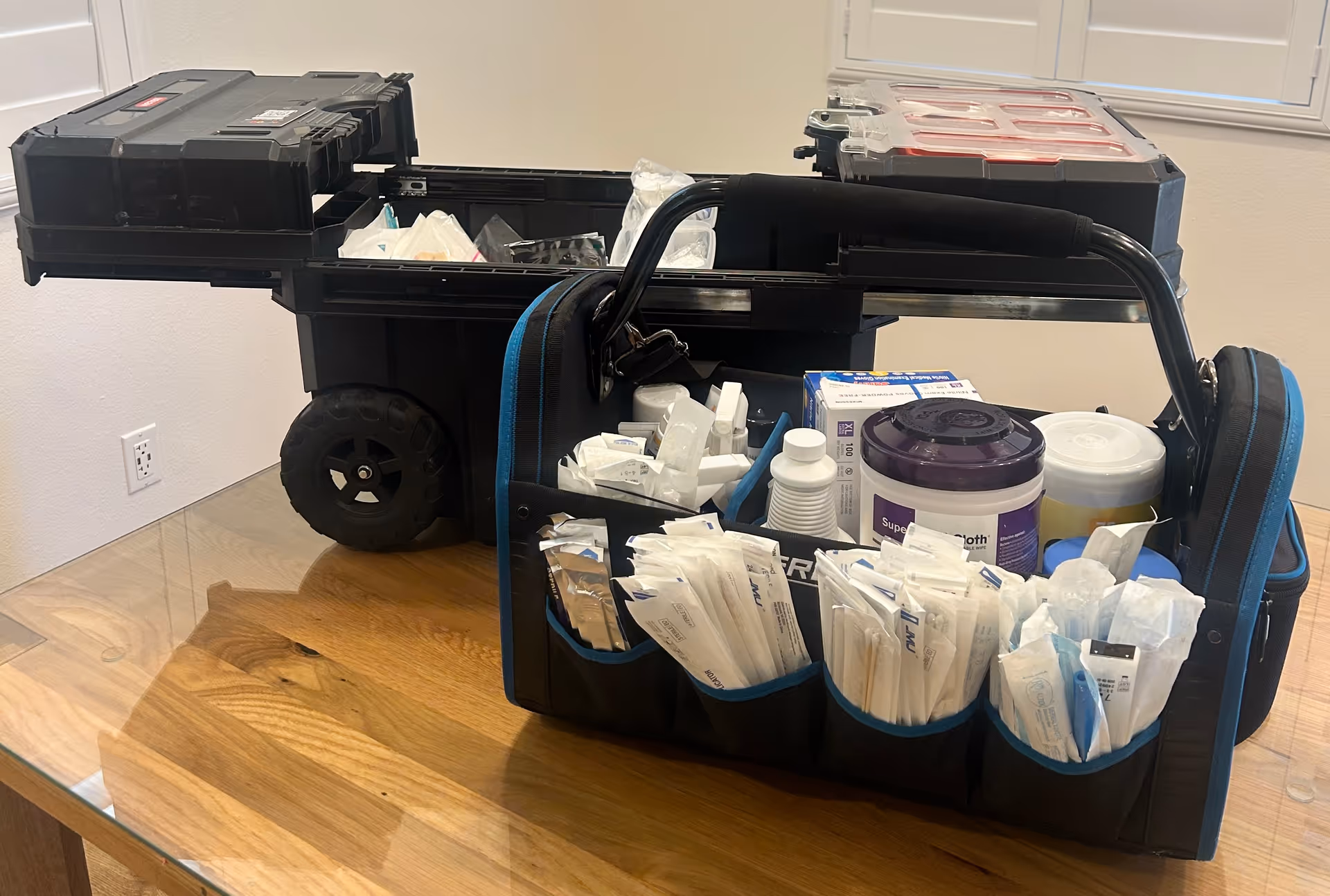 Mobile wound care cart filled with supplies on a glass-topped table