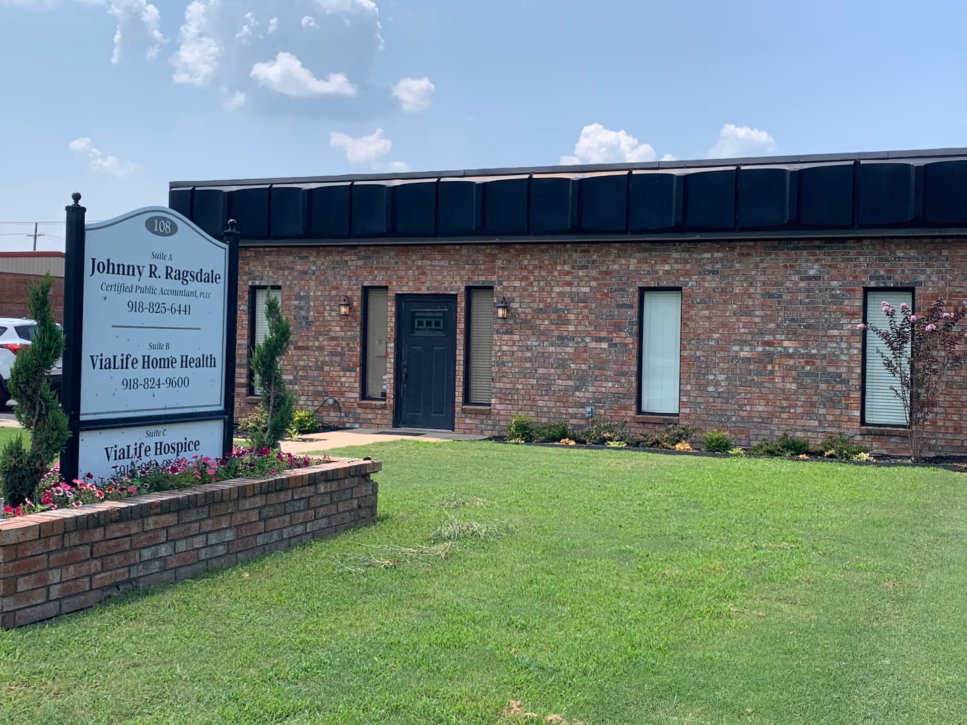 Brick building exterior with a sign for ViaLife Home Health and Hospice
