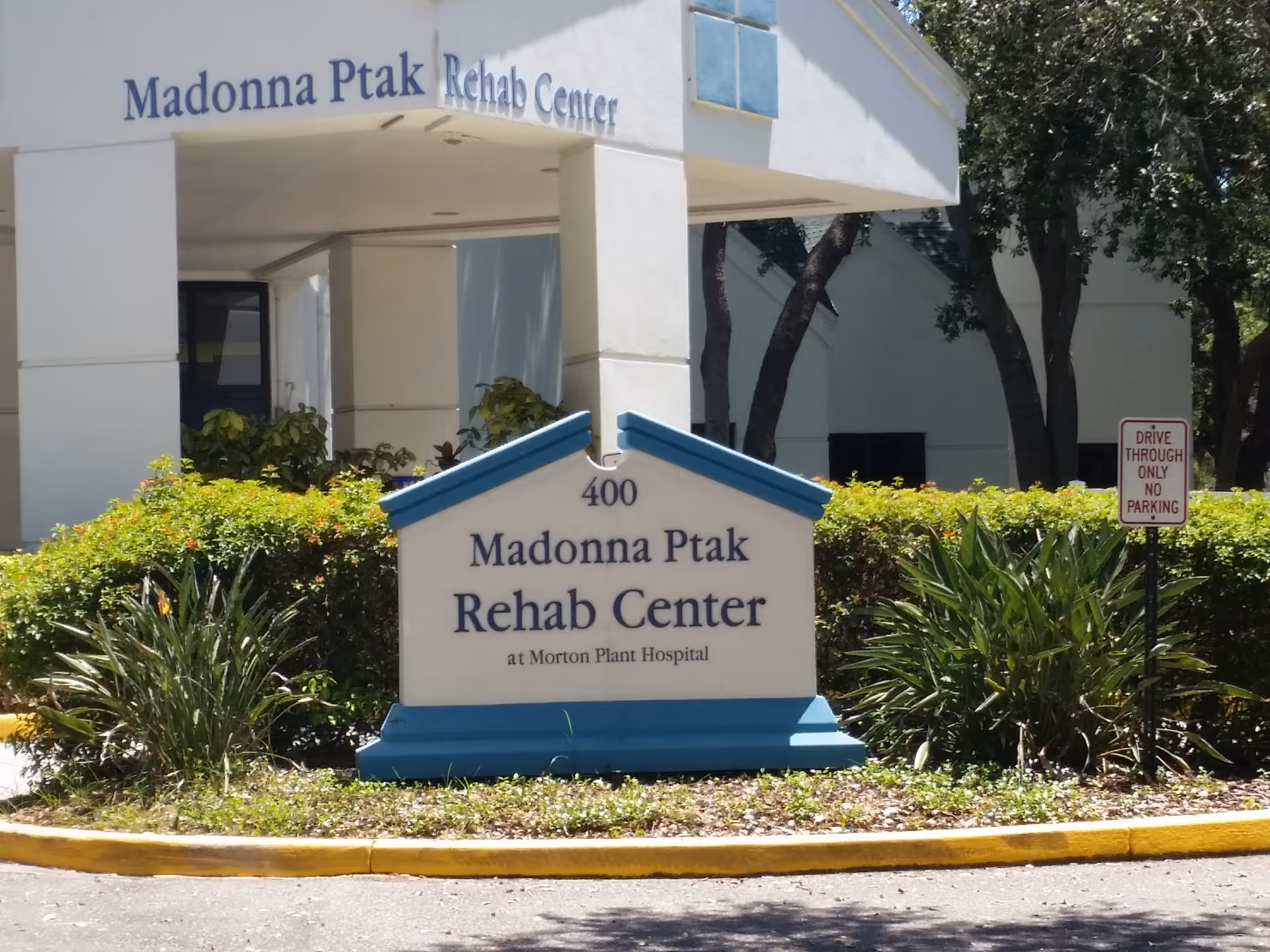 The front exterior shows Madonna Ptak Rehab Center with signage and entrance.