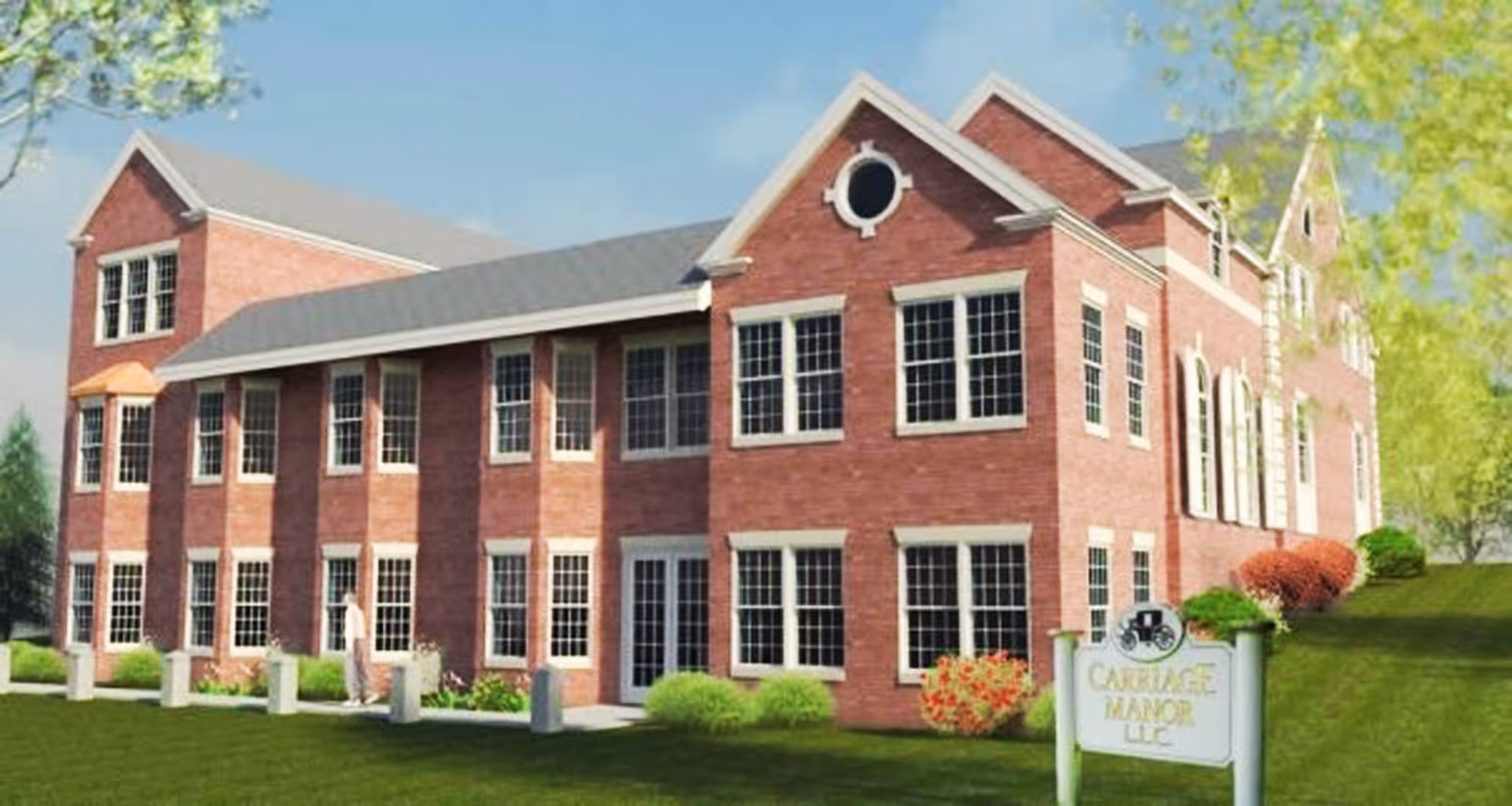 Brick senior living facility exterior with manicured lawn and Carriage Manor sign.