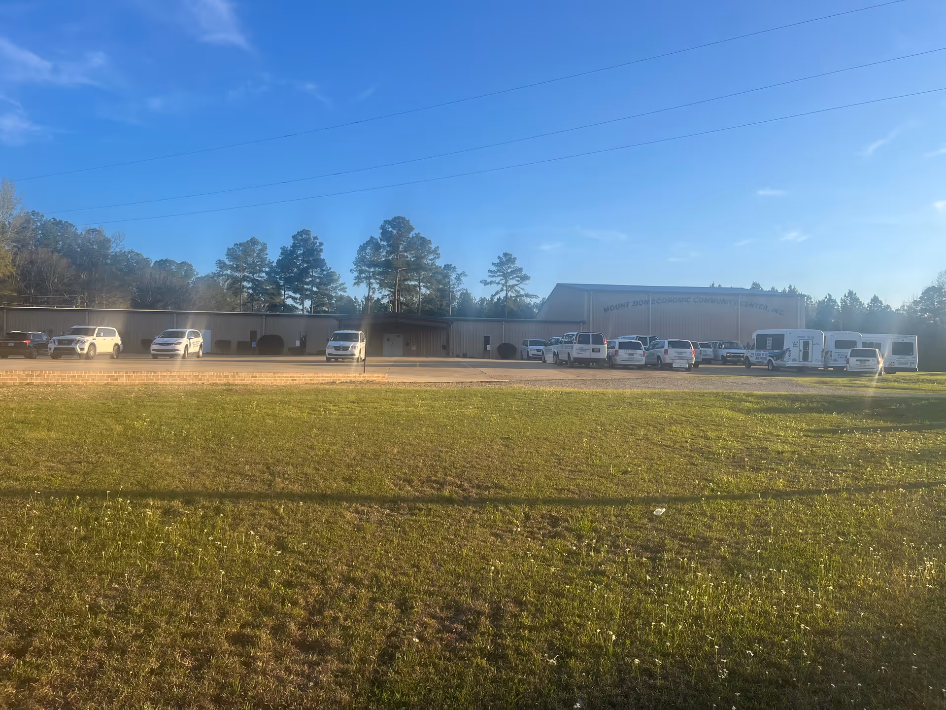 Front view of Mt. Zion Economic Community Center, Inc. with parked cars along the building.