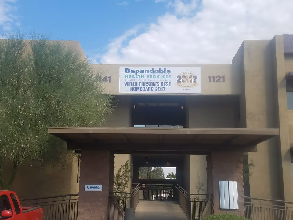 Front of a beige building with a Dependable Health Services banner over the entrance.