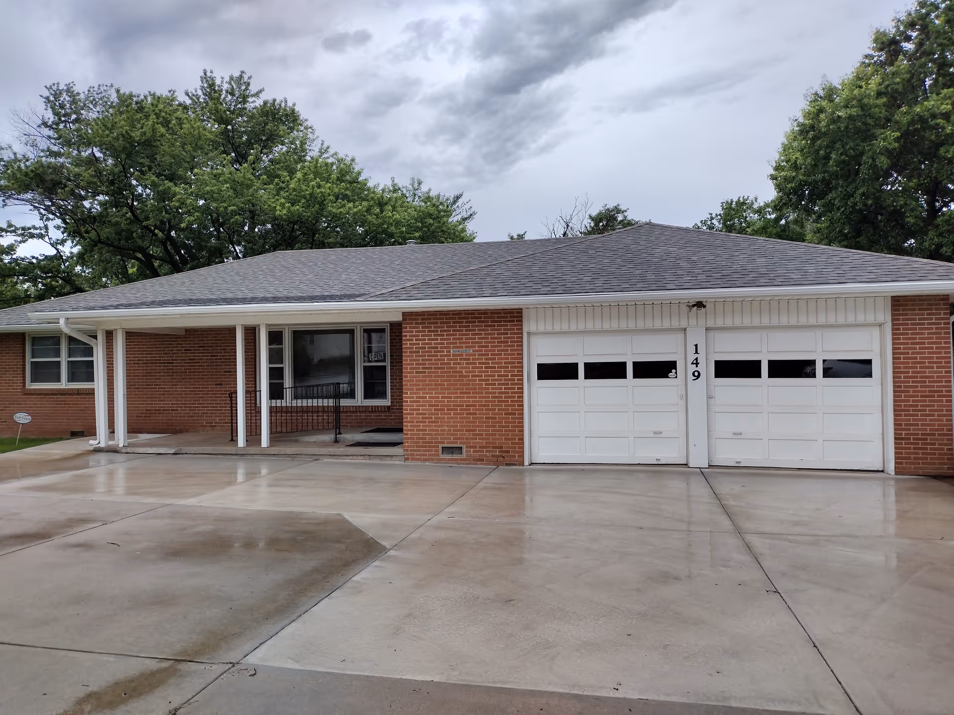 A single-story brick facility with a two-car garage and covered front entry.