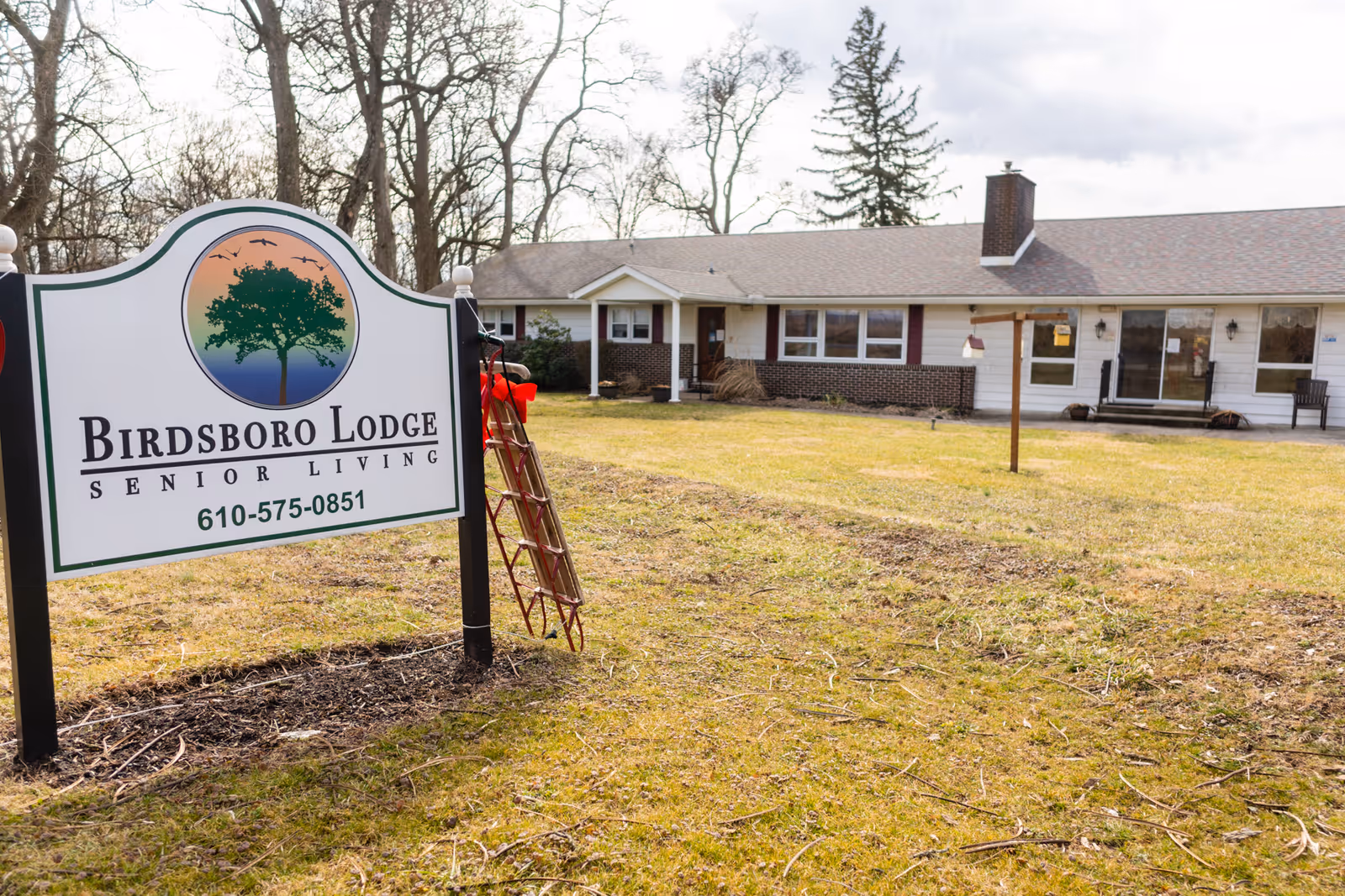 Birdsboro Lodge Senior Living exterior with a large sign beside a single-story building.
