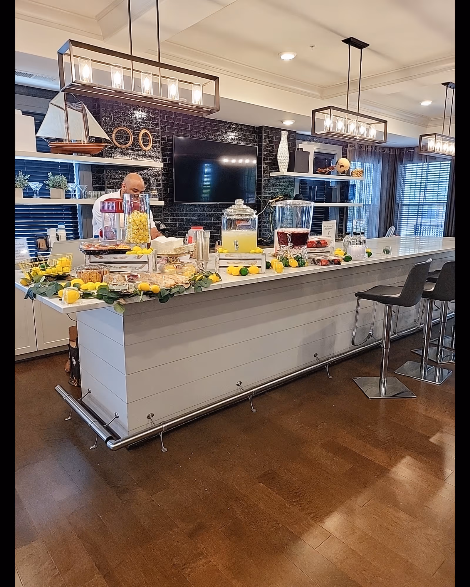 Bright modern dining bar in Harmony & Hope Health Care, with staff preparing beverages.