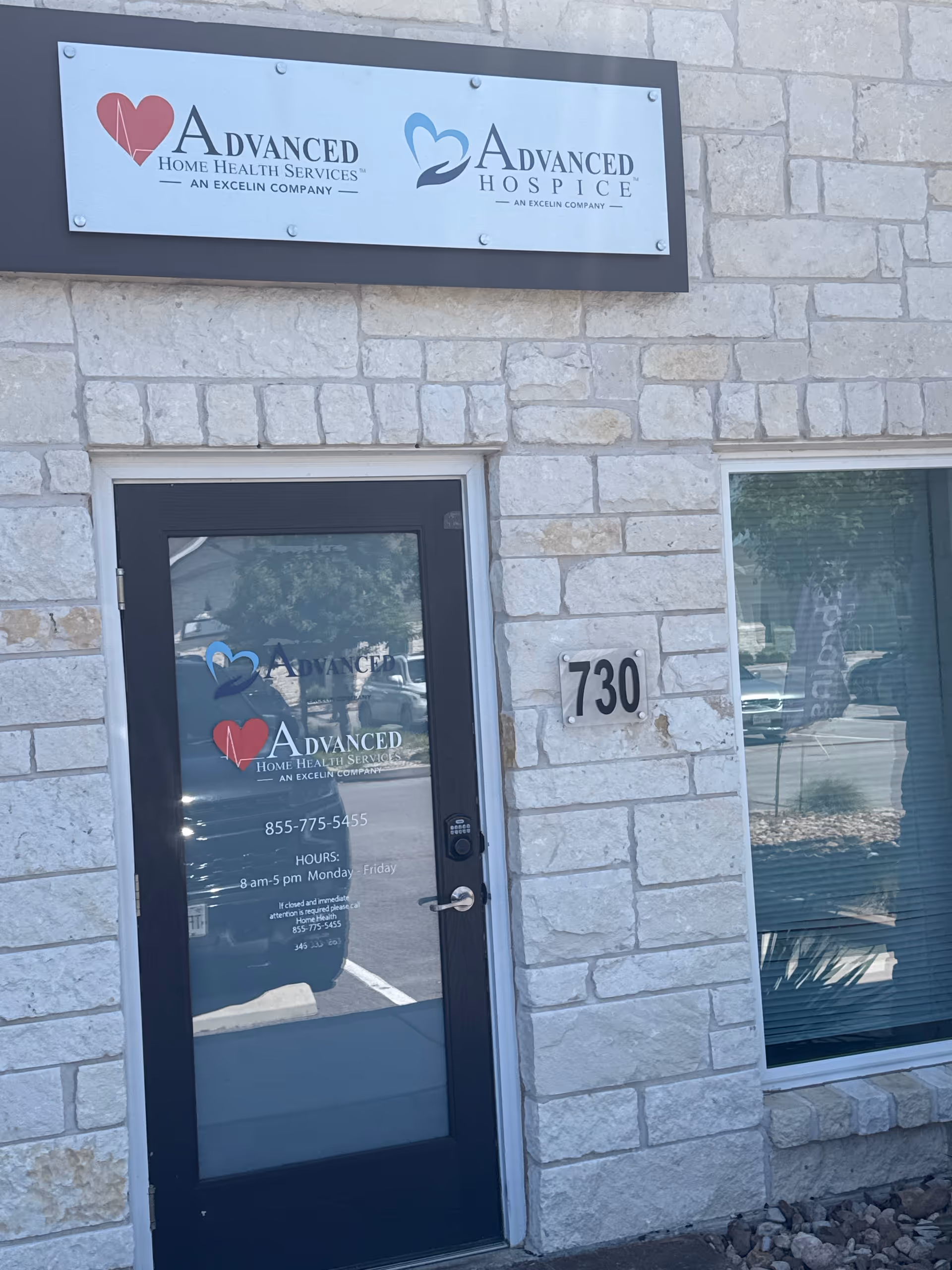 Stone-clad facility entrance shows signs for Advanced Home Health Services and Advanced Hospice.