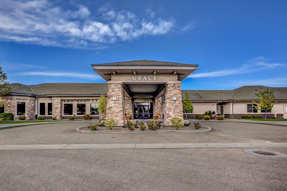 Grace Assisted Living Meridian entrance with stone pillars and blue sky.