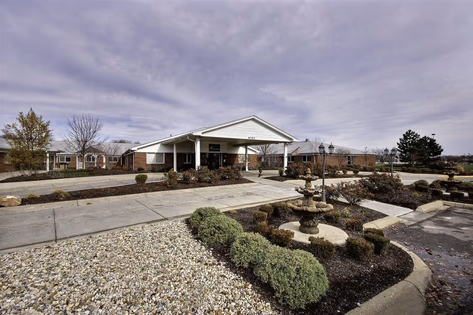 Front view of Eagle Creek Healthcare Center with landscaped entrance and fountain.