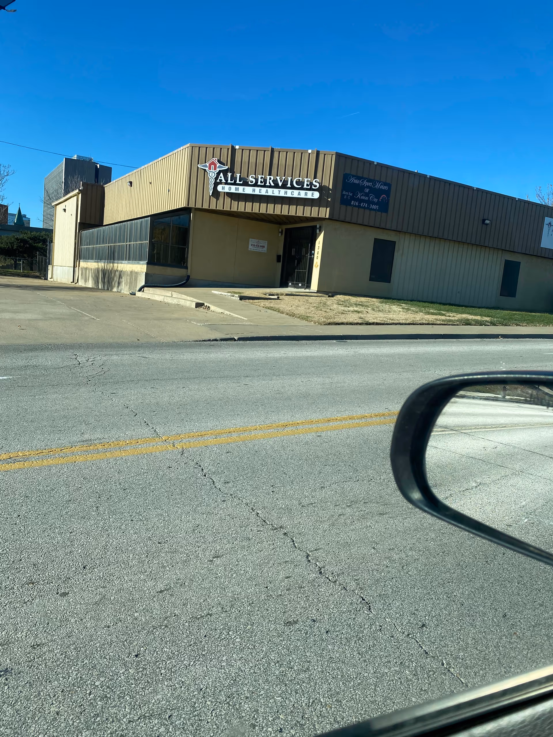 Exterior view of All Services Home Health Care building along a street.