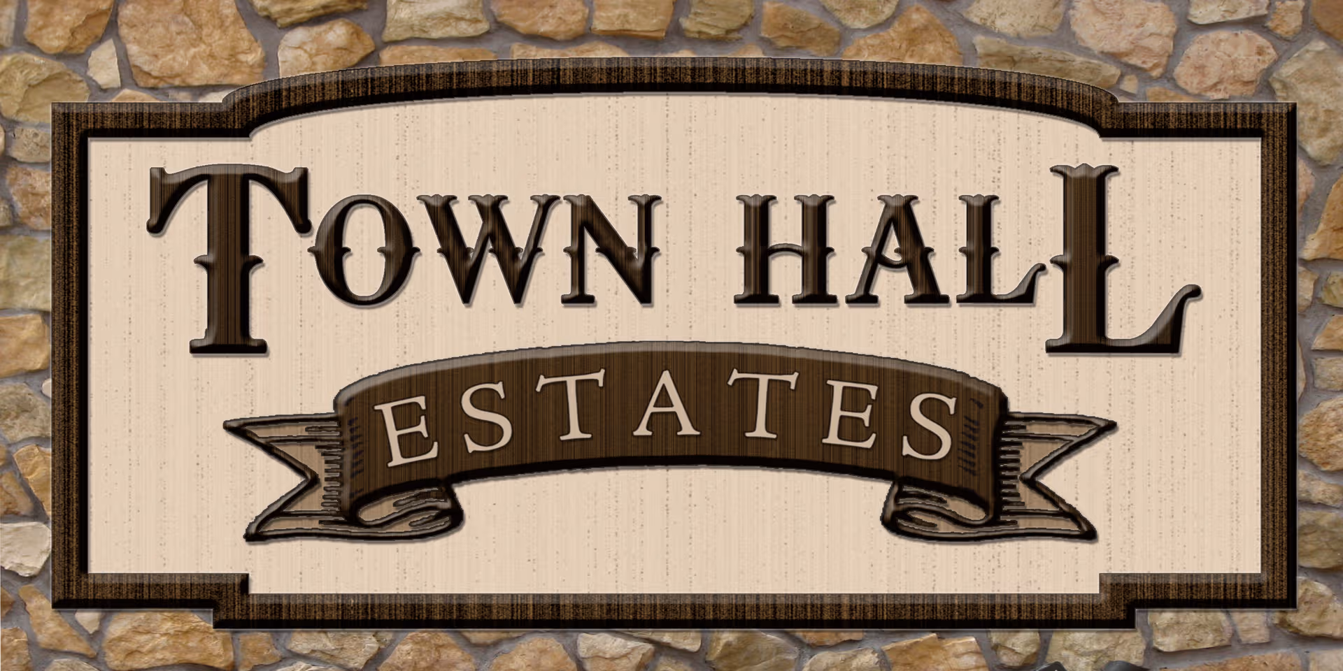 Town Hall Estates sign mounted on a stone wall