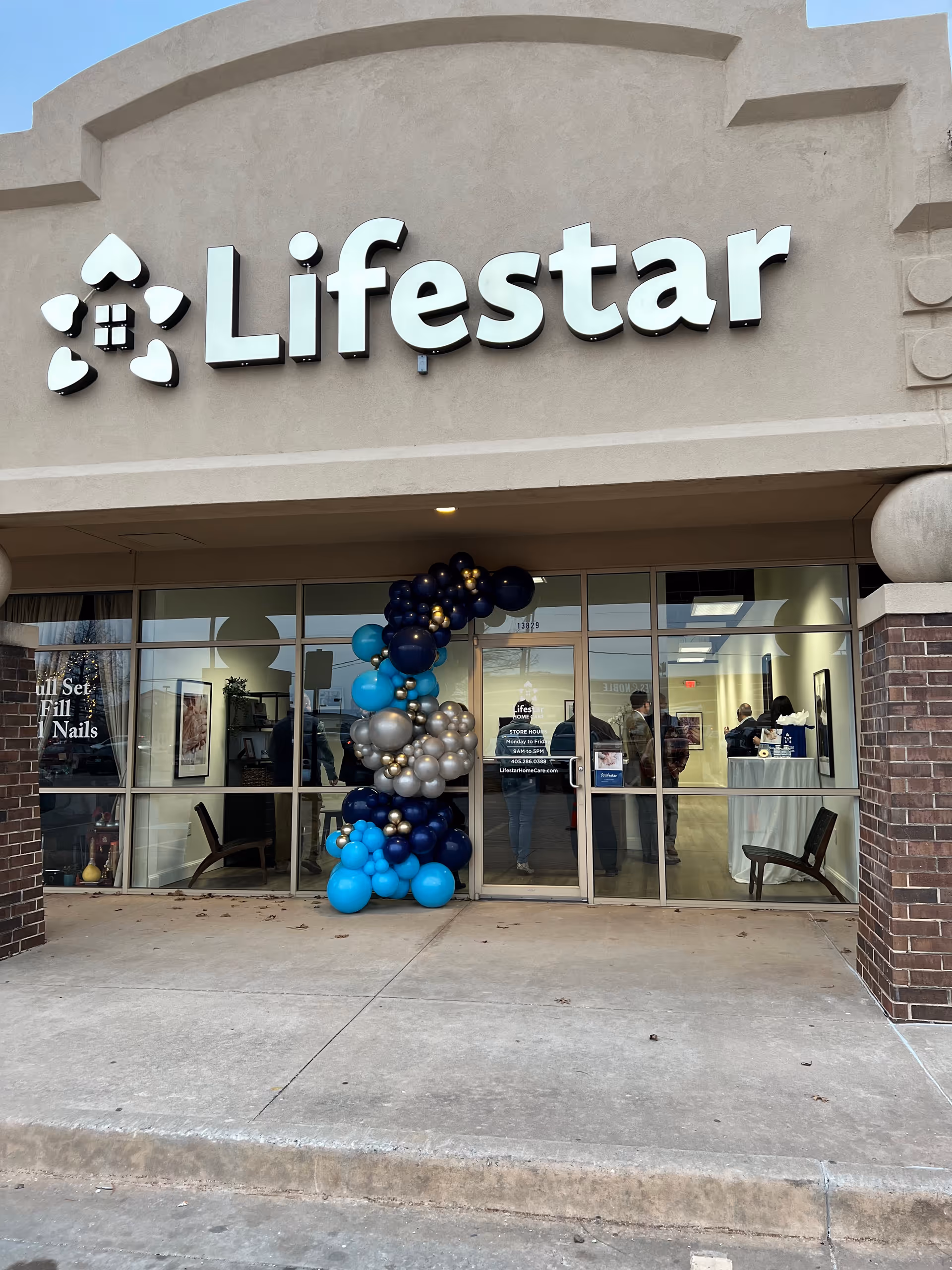 Storefront of Lifestar Home Care with balloon arch at entrance
