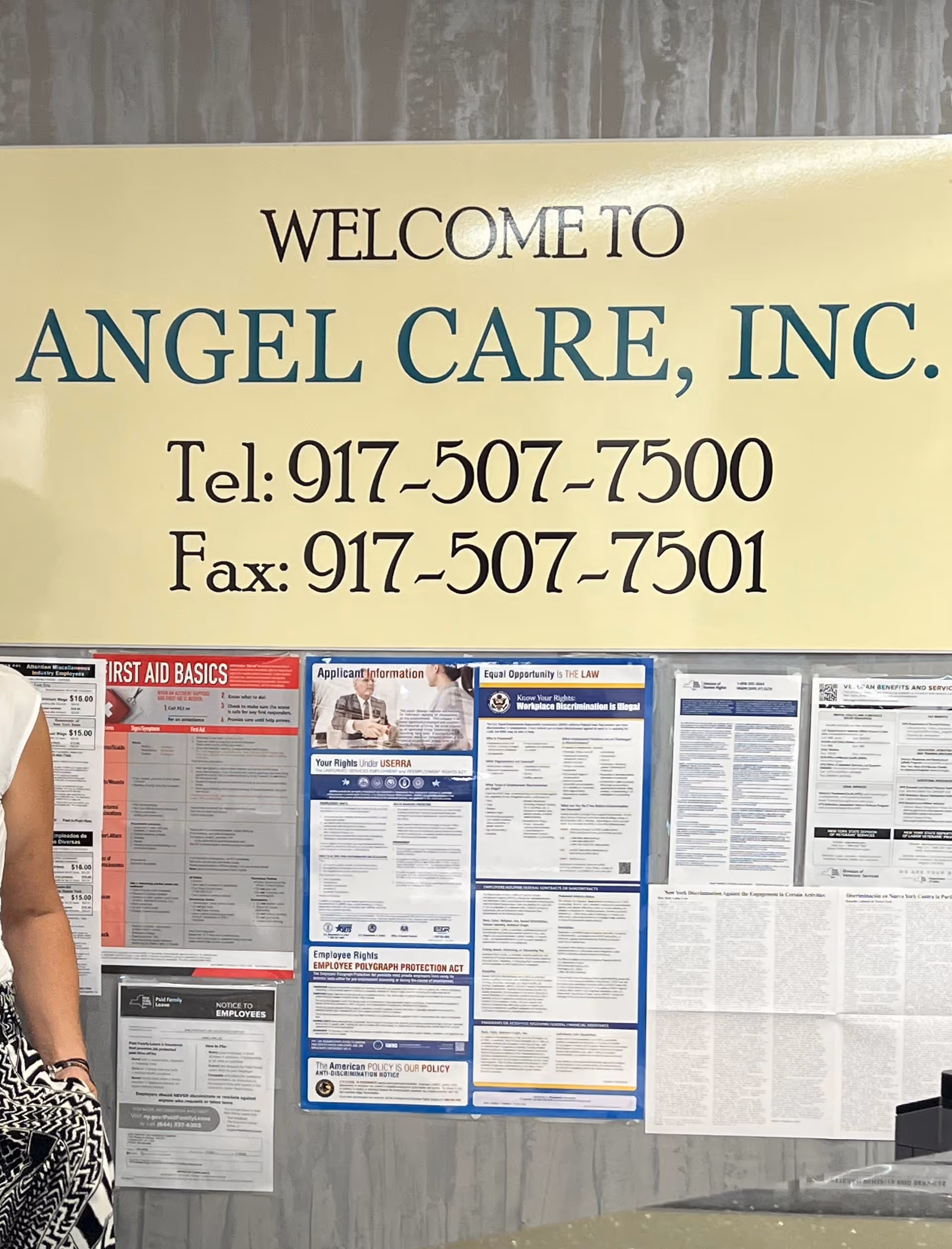 Welcome to Angel Care, Inc. sign with phone numbers and employee bulletin boards.