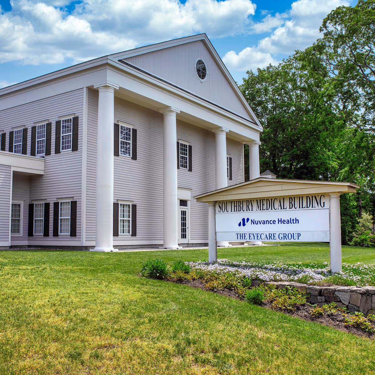 White two-story building with columns and a sign for Southbury Medical Building.