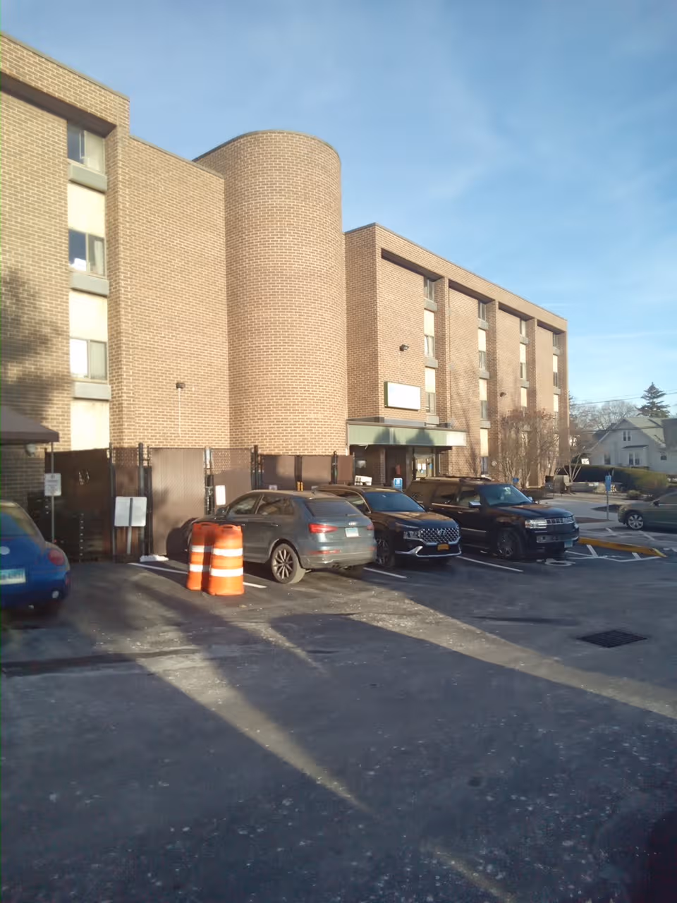 Exterior of Civita Care Center at Danbury, brick building with cars in the parking lot.