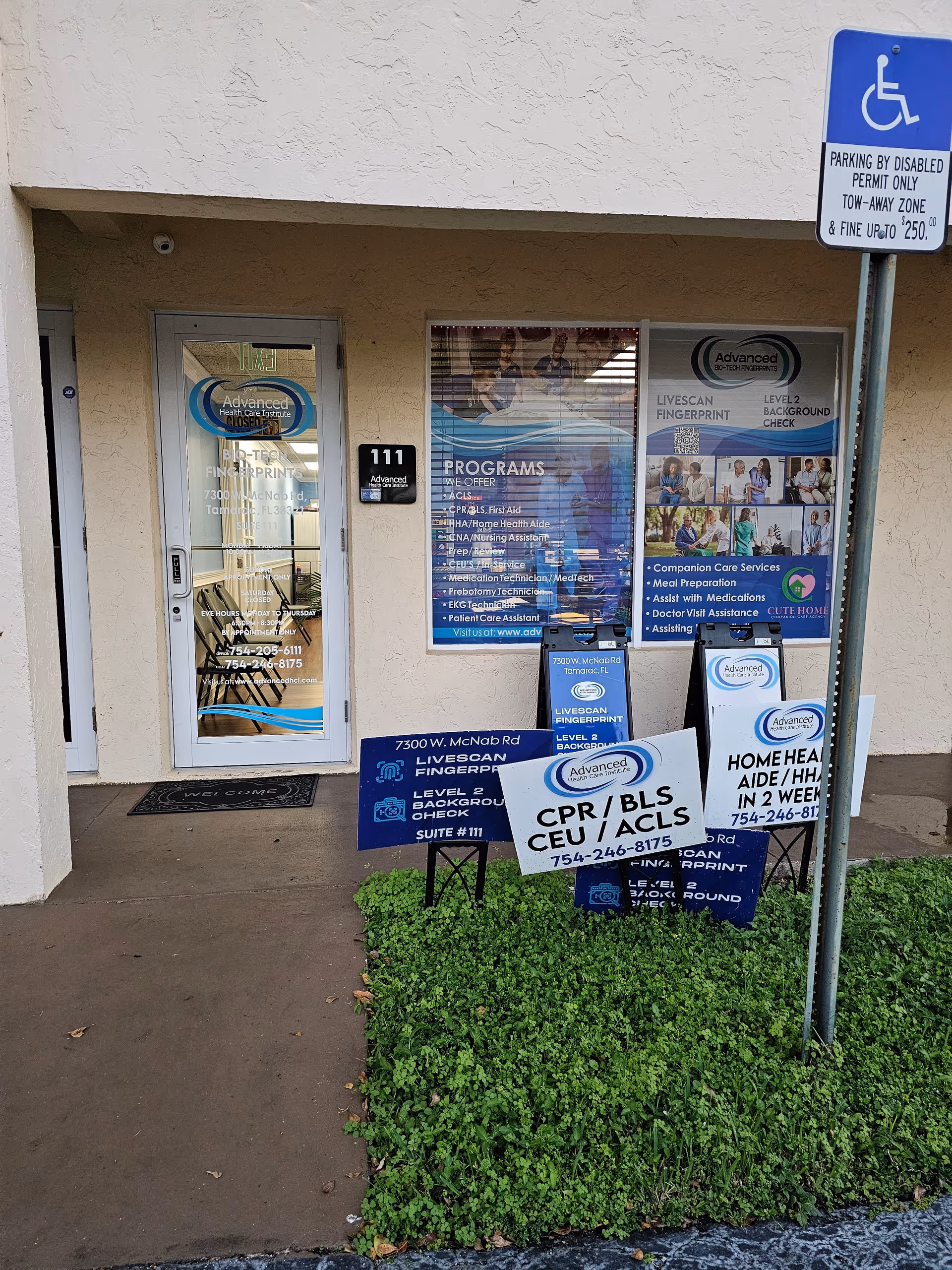 Entrance to Cute Home Companion Care agency with glass door and signs outside.