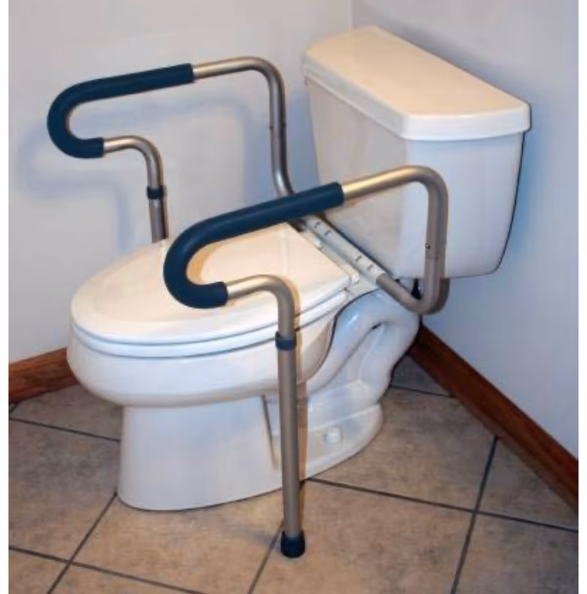Accessible bathroom with a toilet and safety grab bars.