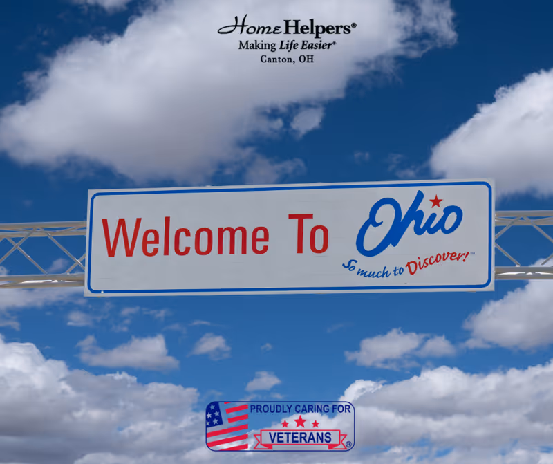 Exterior view of a large 'Welcome To Ohio' sign with Home Helpers Canton, OH text.
