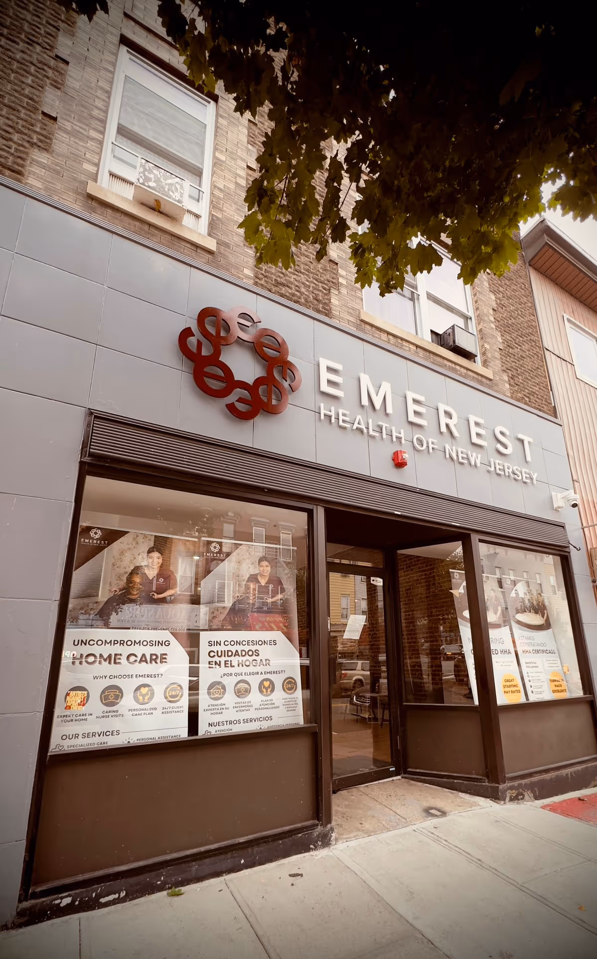 Exterior storefront of Emerest Health of New Jersey with sign, windows, and sidewalk.