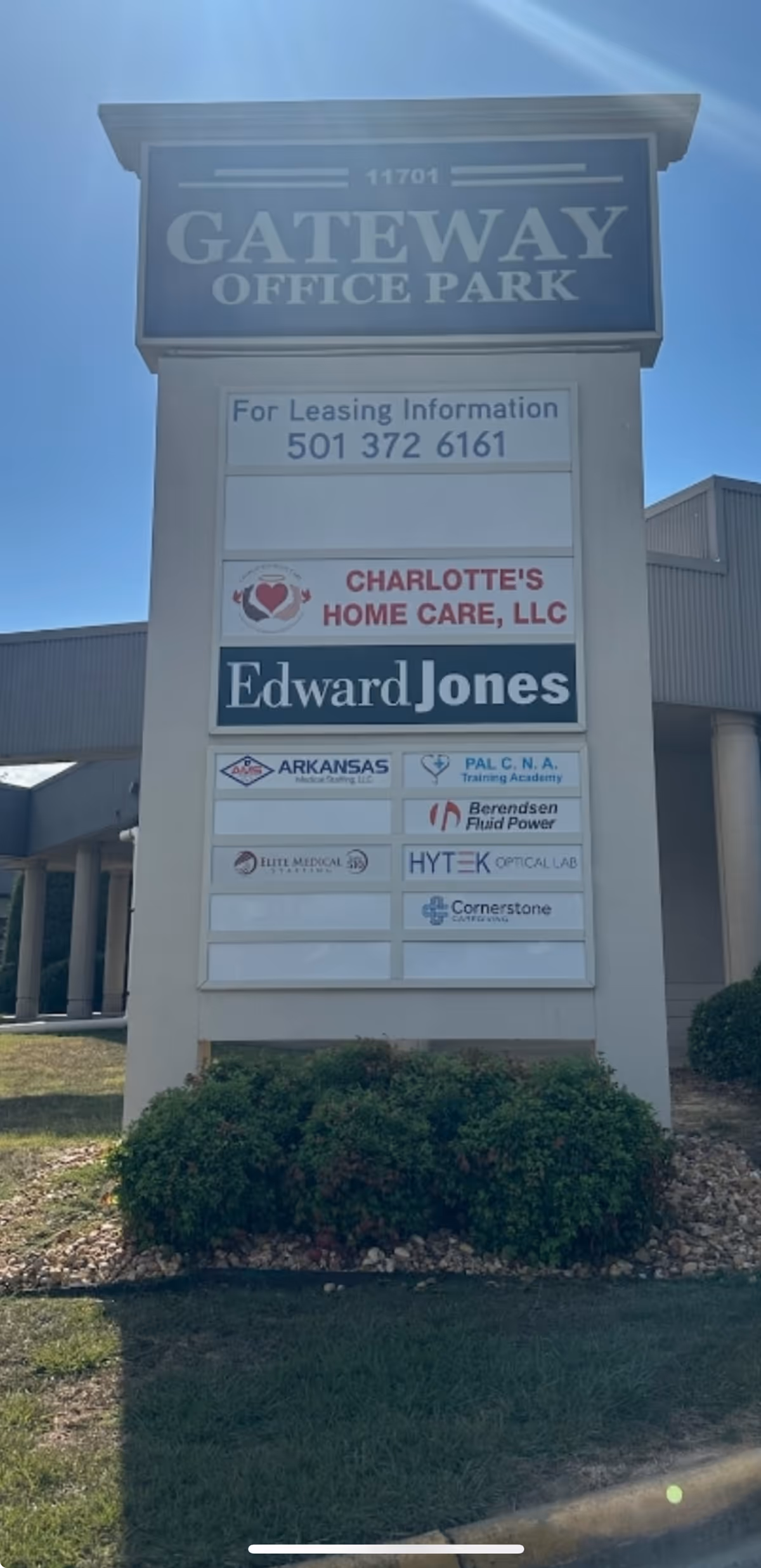 Tall front sign displaying Charlotte's Home Care and other tenants.
