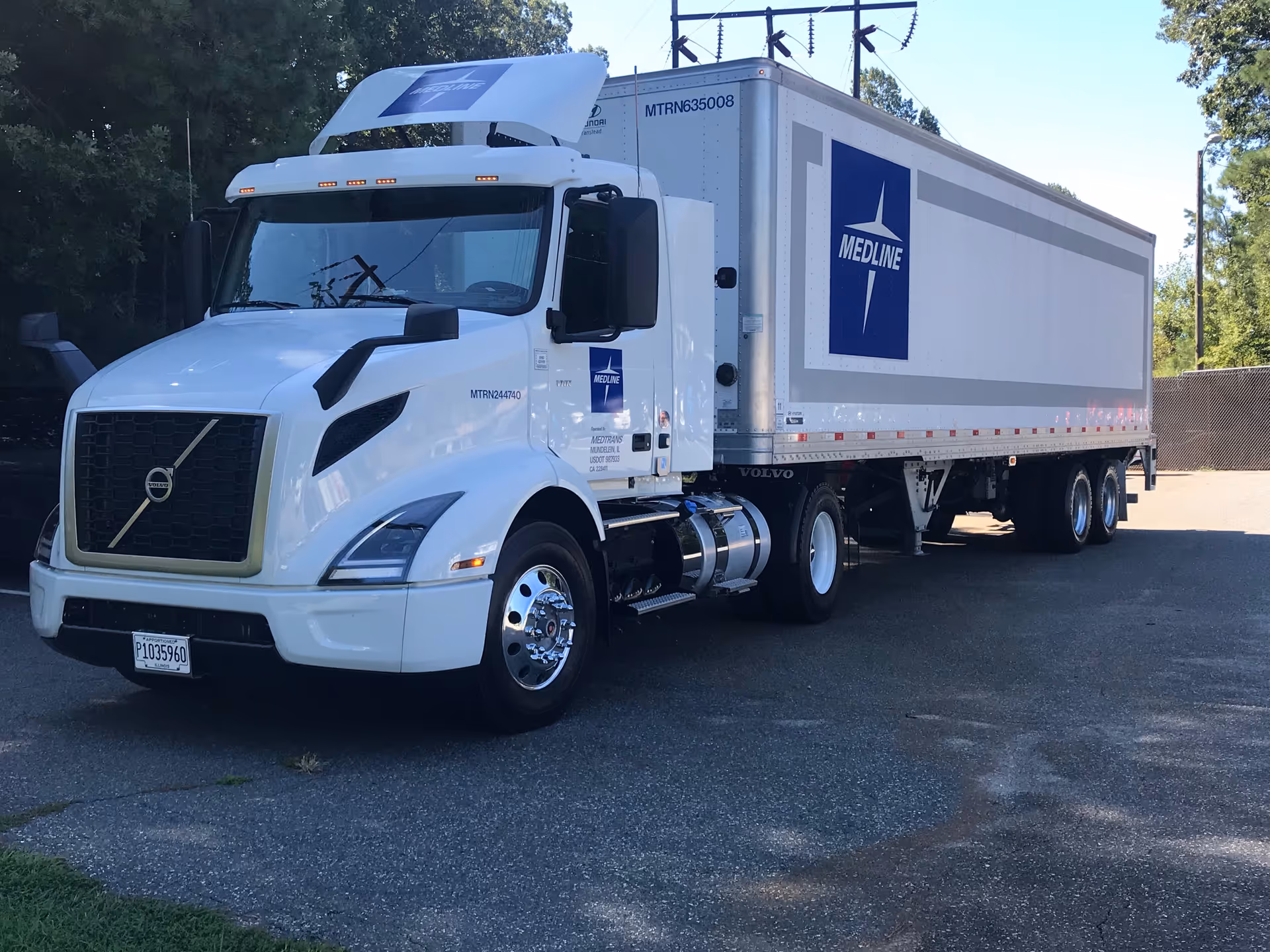 White delivery truck with Medline logo parked in a paved lot.