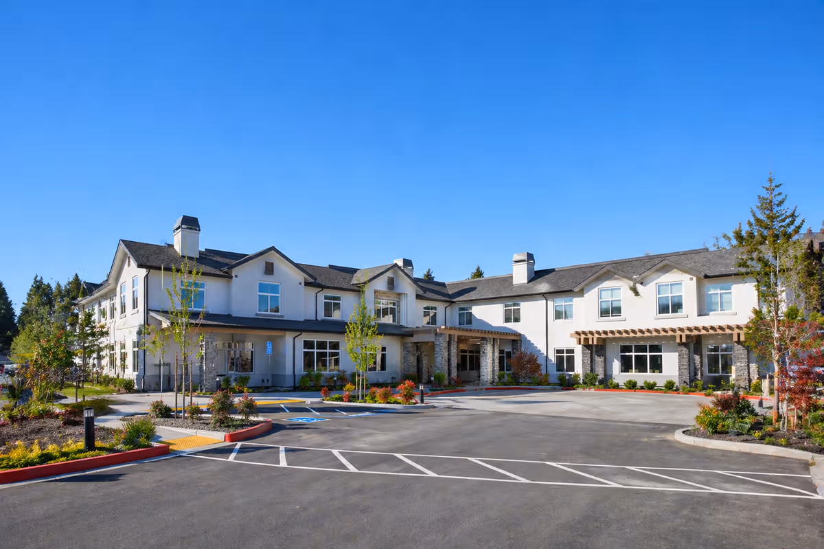 Exterior view of Santa Rosa Hills Senior Living building with parking.