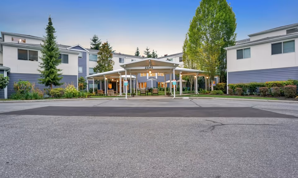 Front view of Mountlake Terrace Plaza showing a covered entrance and landscaping.