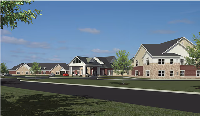 Exterior view of Vista Springs Quail Highlands senior living campus with connected buildings.