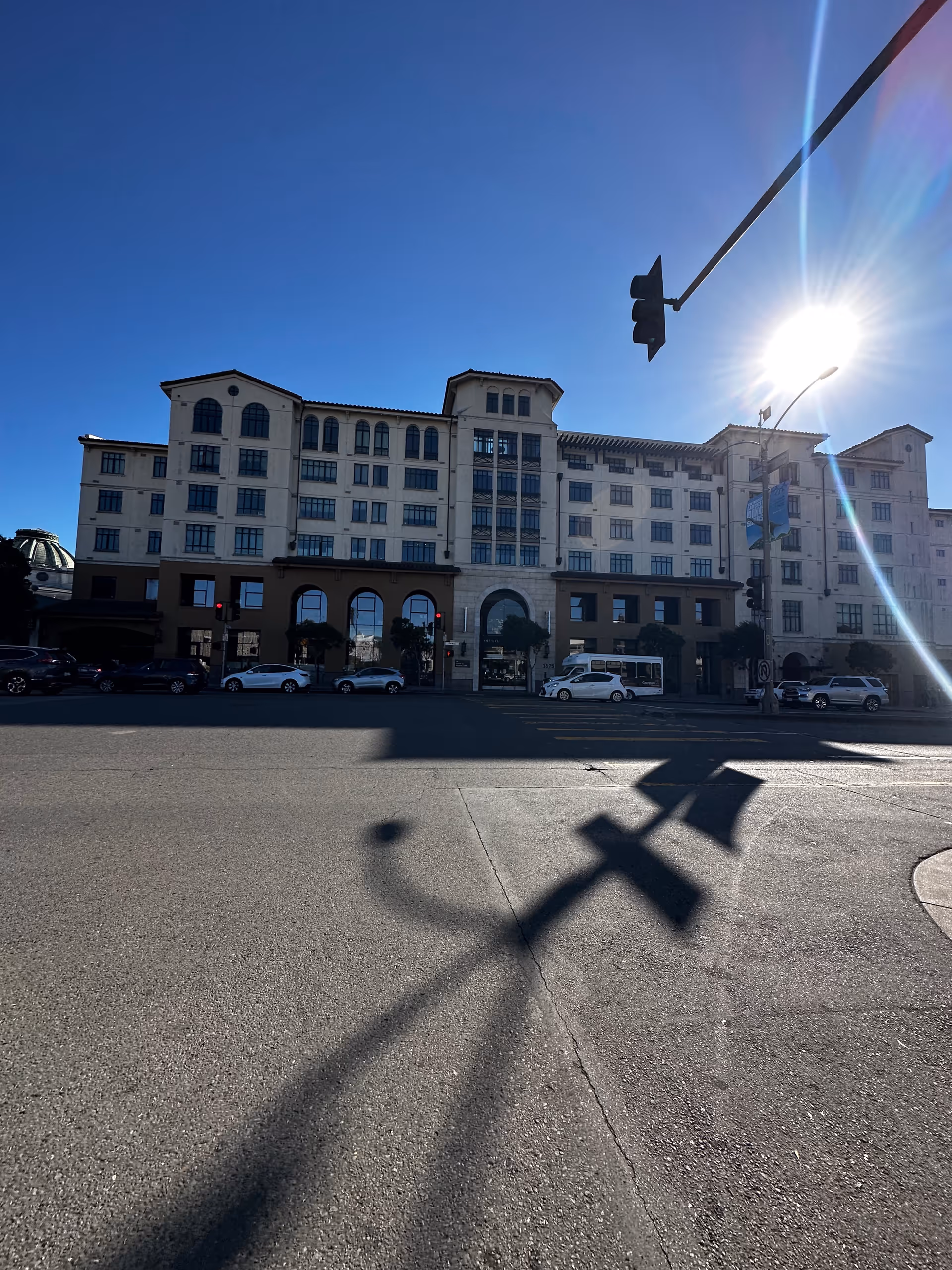 Exterior view of Institute on Aging San Francisco, a large building with arched entrance.
