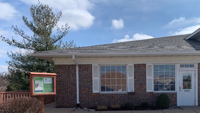 Brick building exterior with a signboard and front entrance for Good Samaritan Senior Care.