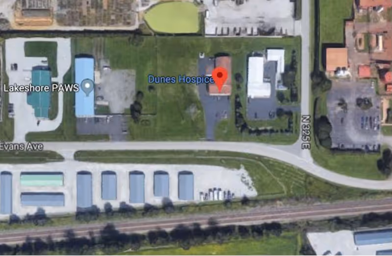 Aerial view of Dunes Hospice campus with surrounding roads and parking.