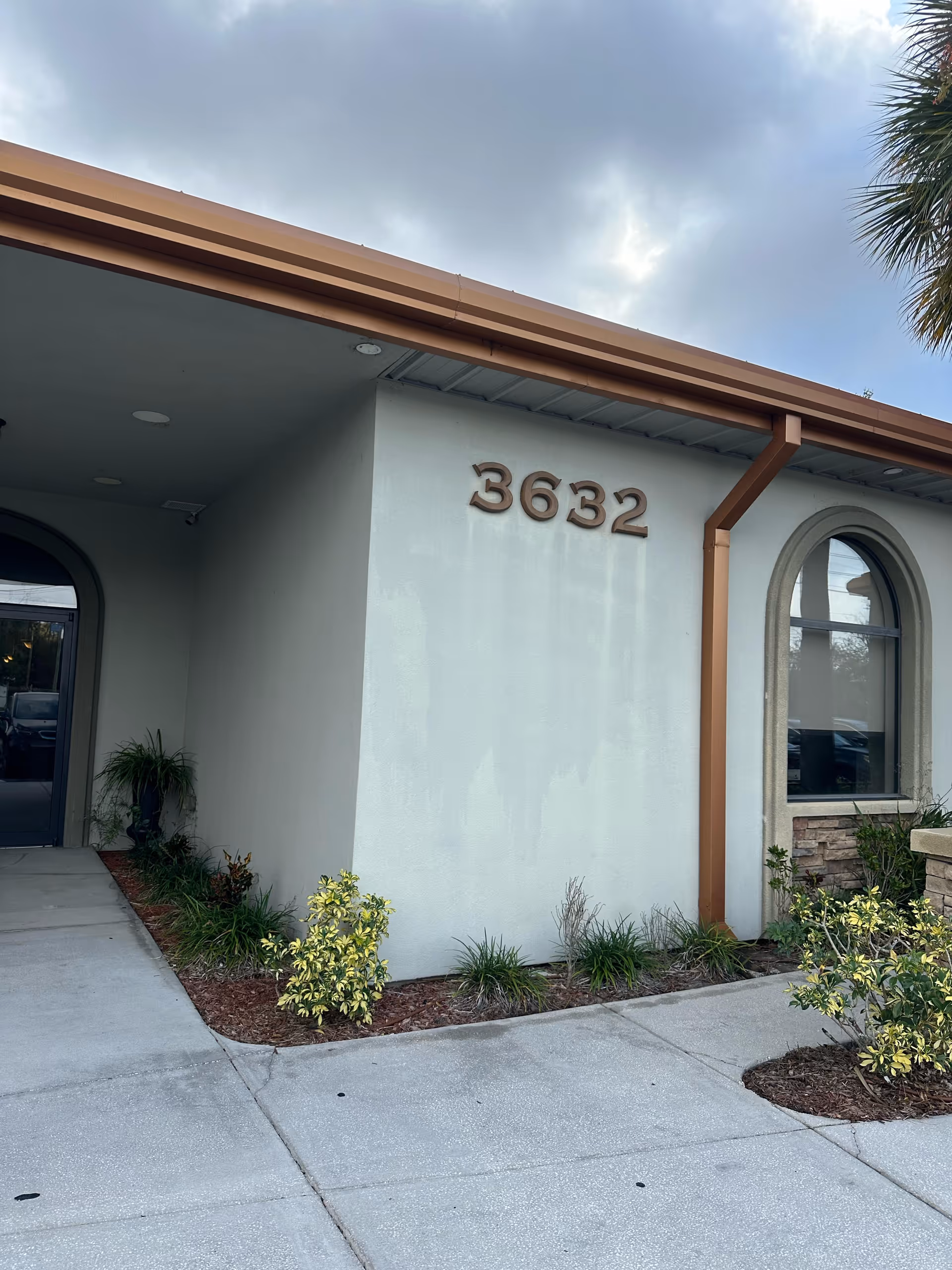 Front exterior of a senior living facility with landscaping and the number 3632.