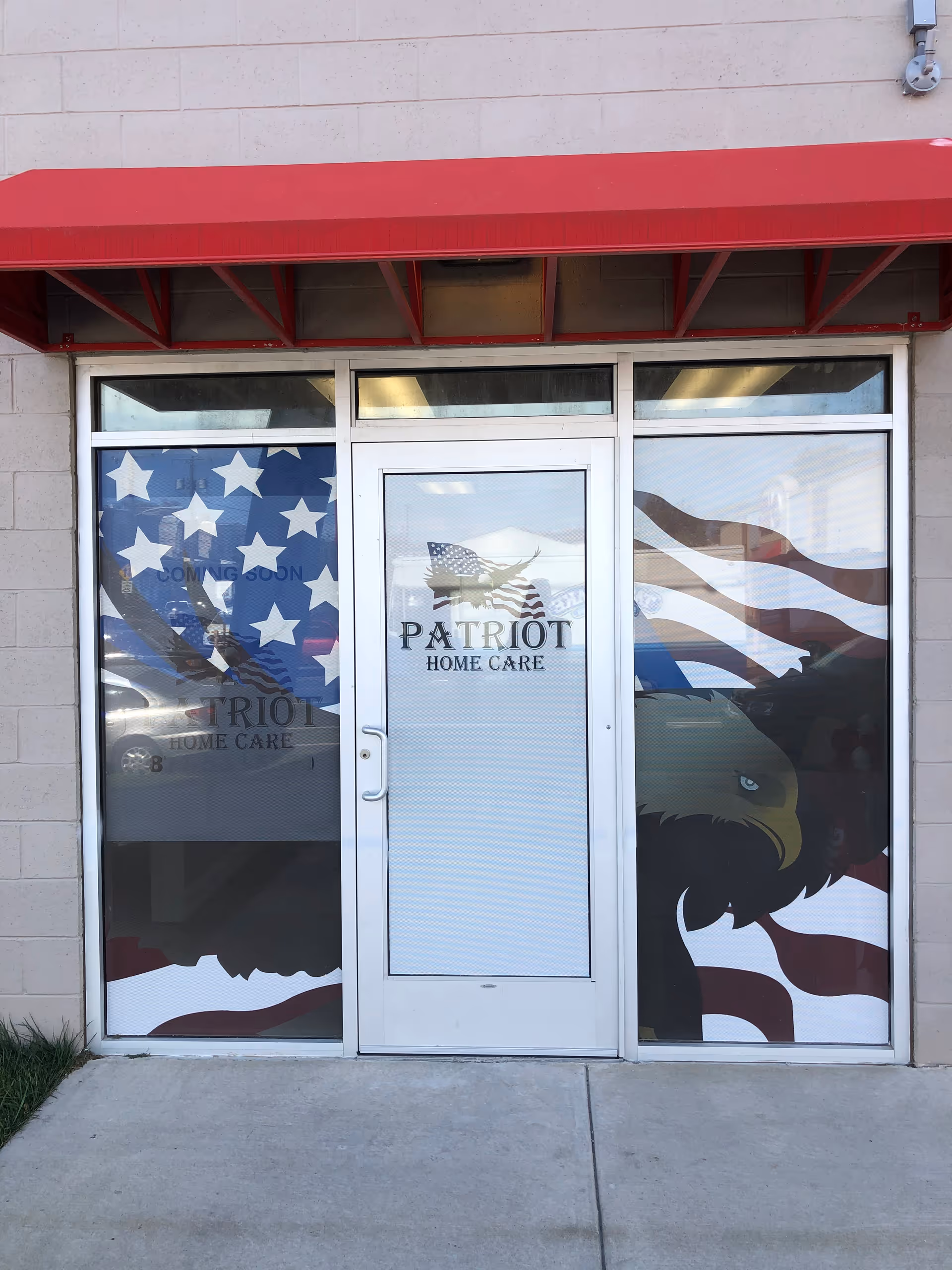 A storefront shows Patriot Home Care entrance with American flag graphics under a red awning.