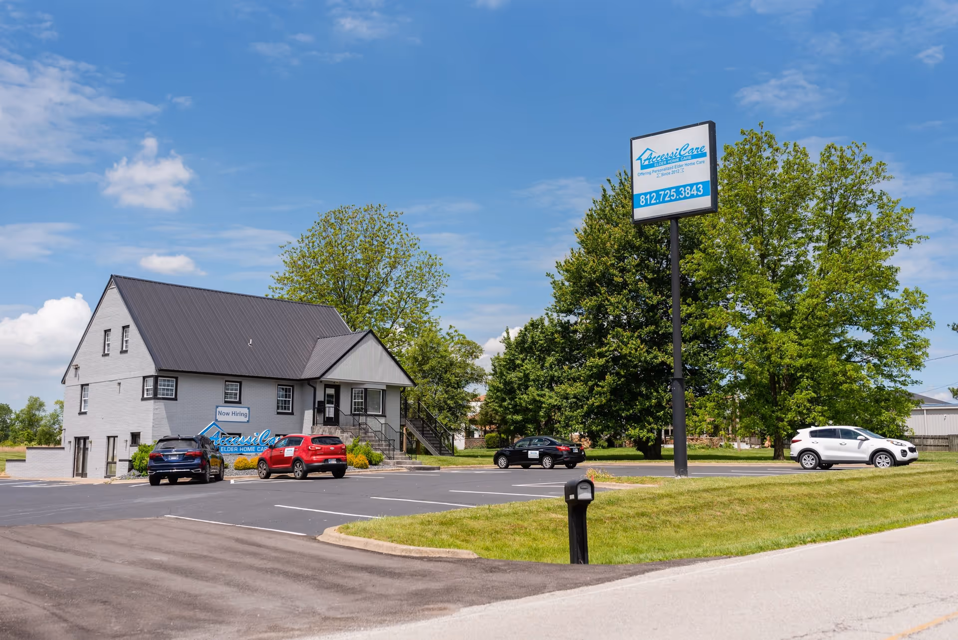 Exterior view of AccessiCare Elder Home Care building with parking and sign