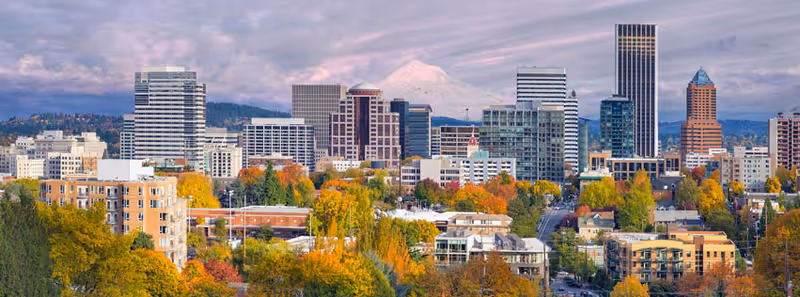 Portland city skyline with autumn trees and tall buildings.