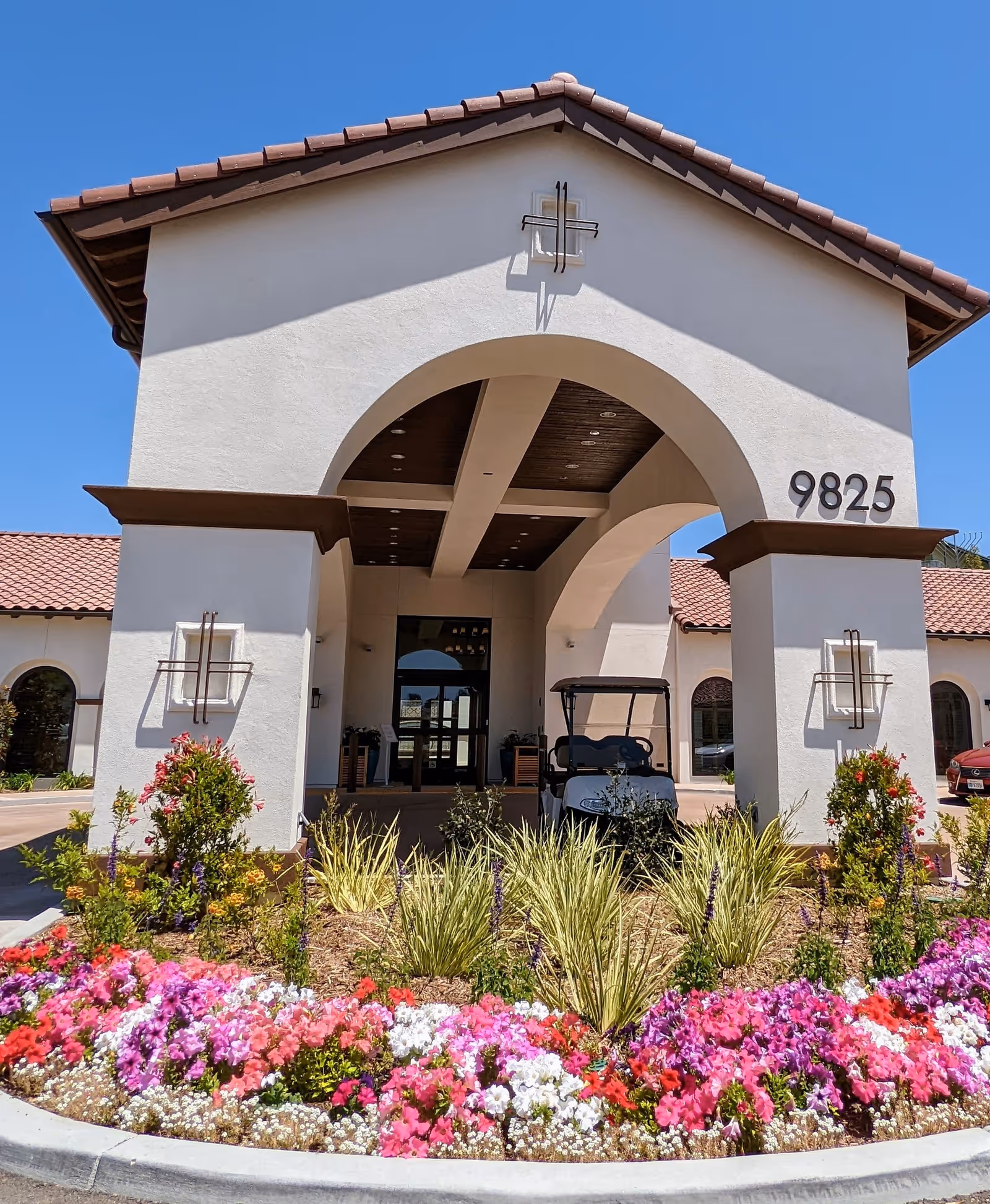 Ridgeview Health Center entrance with archway, landscaping, and clear blue sky.