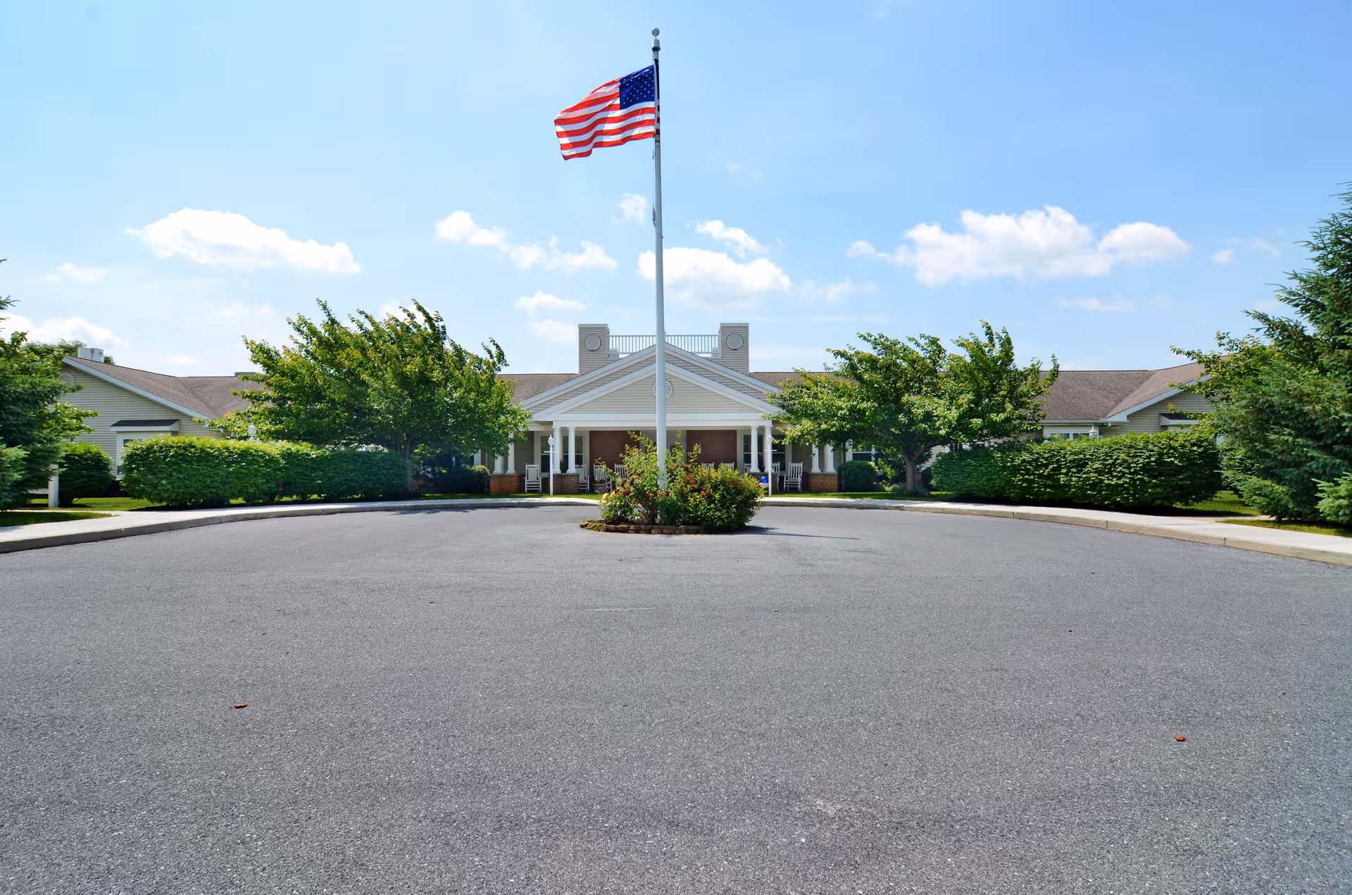Front view of Celebration Villa Lebanon PA with circular driveway and flagpole