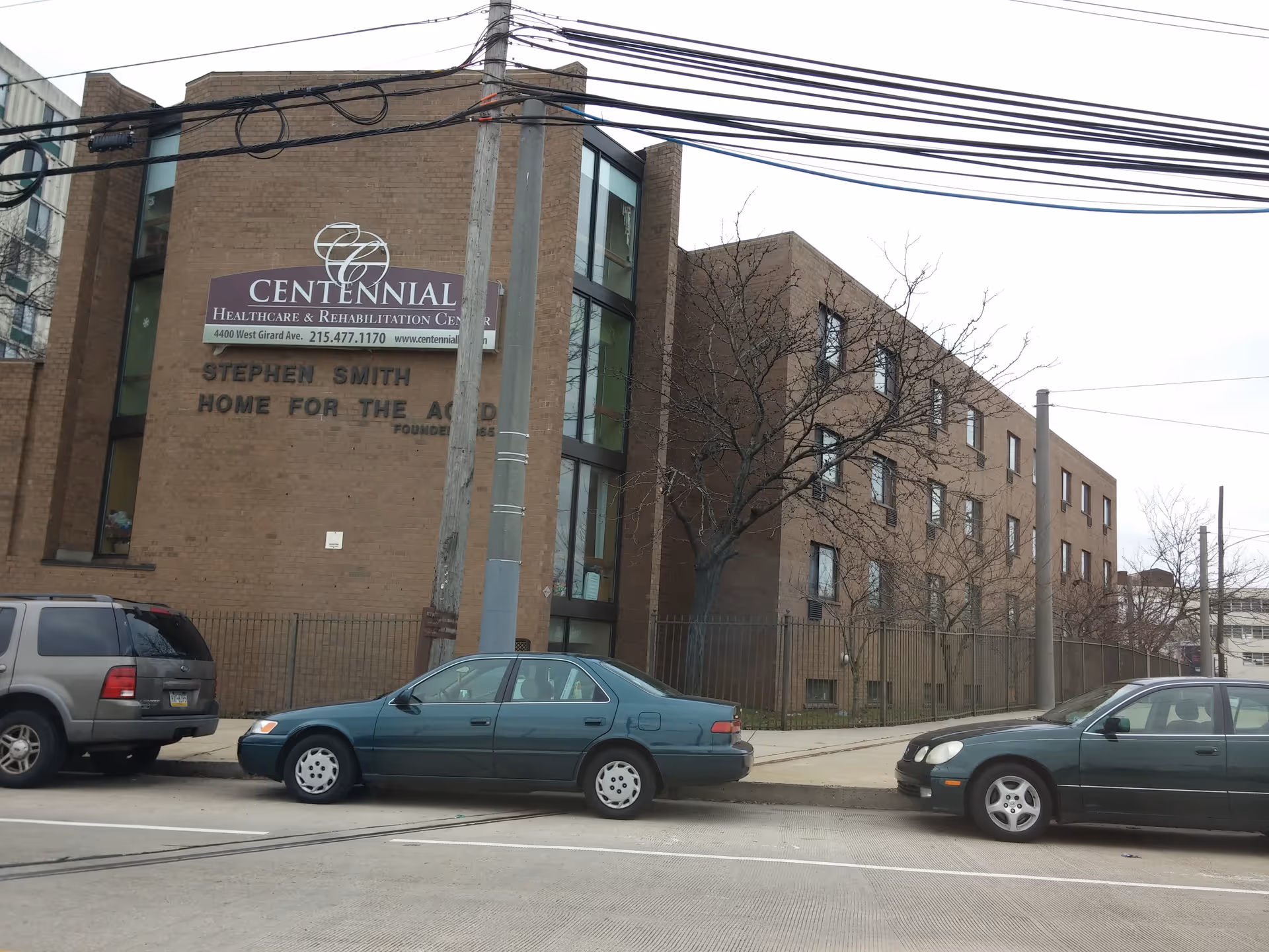 Exterior view of Centennial Healthcare and Rehabilitation Center on a city street