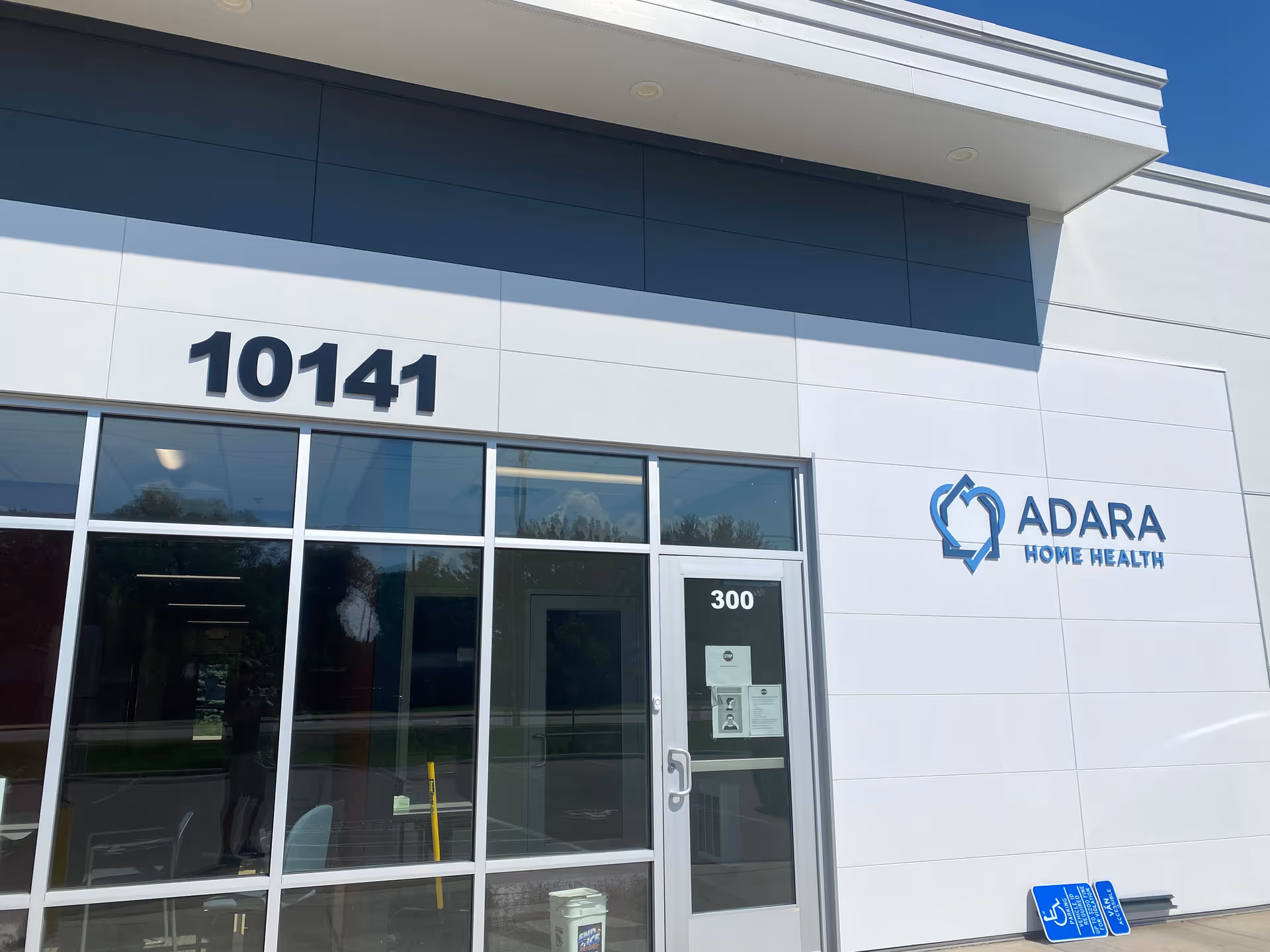 Exterior view of Adara Home Health building with entrance and large windows