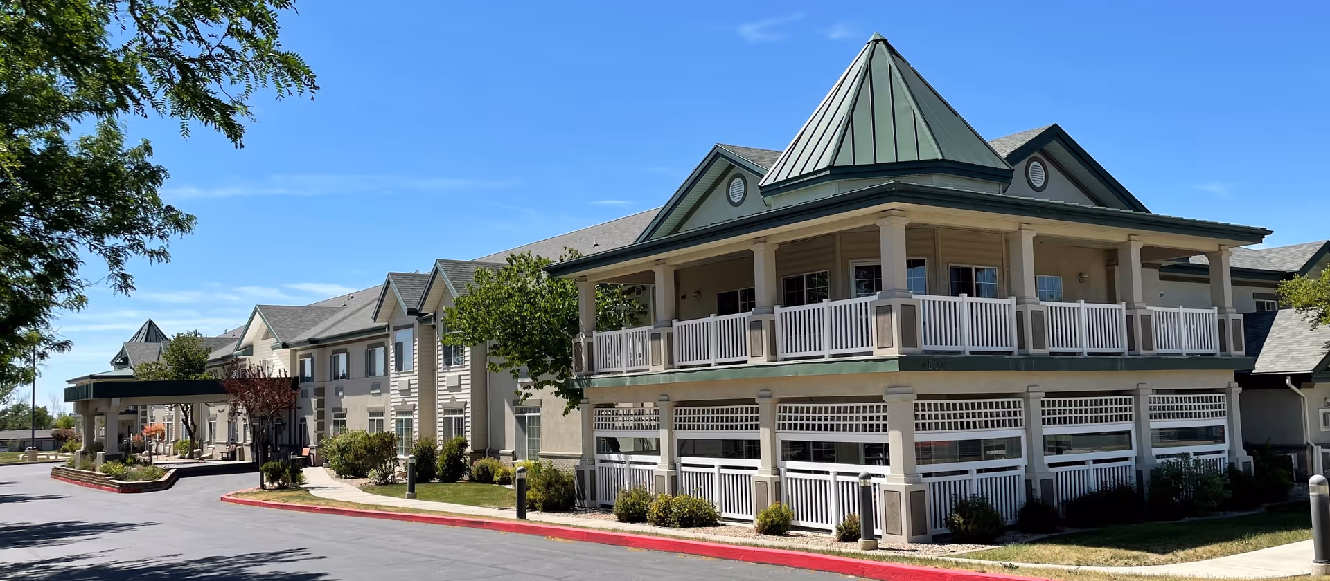 Exterior view of Haven Creek Assisted Living with a multi-story building and surrounding landscaping.