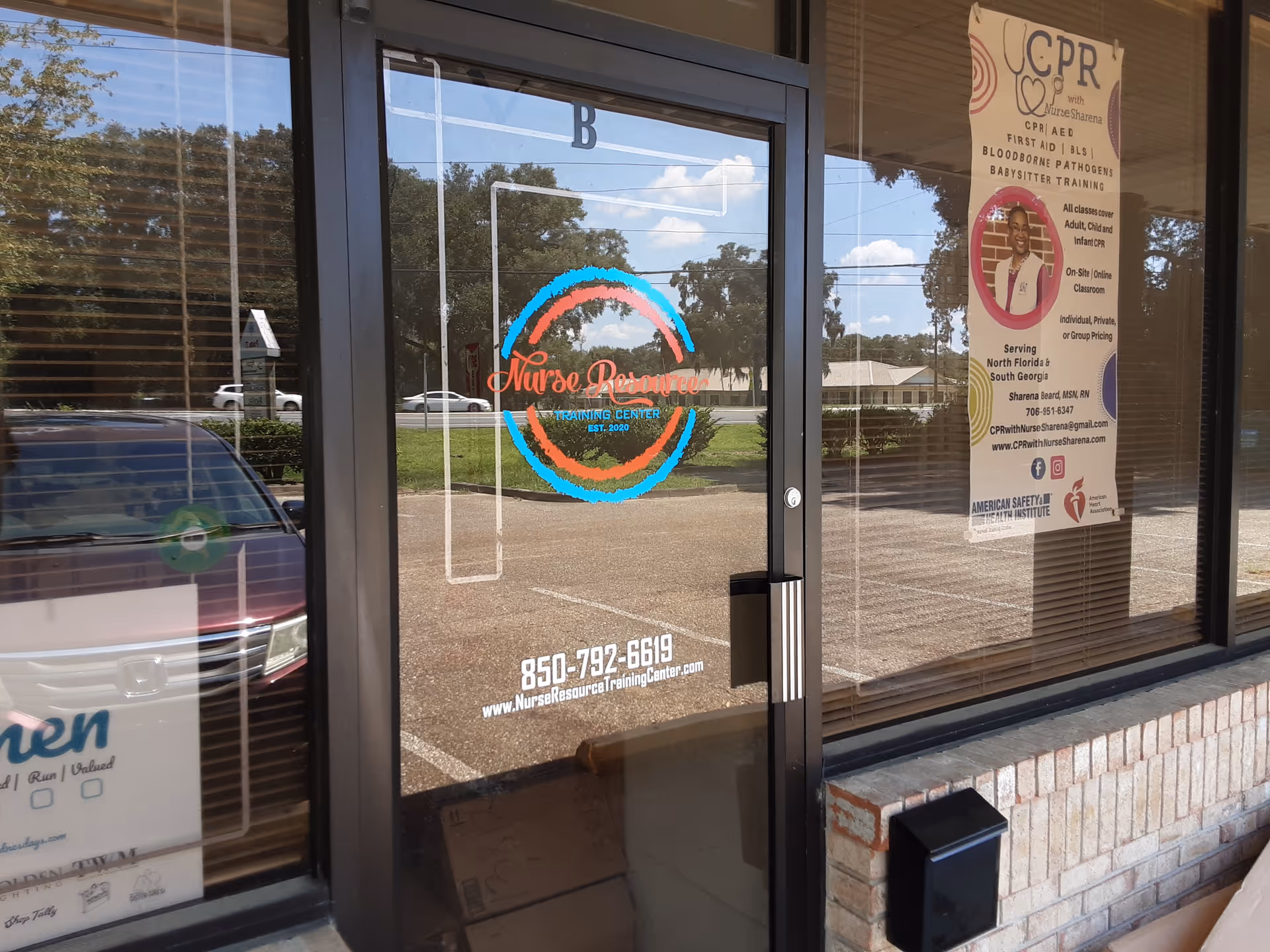 Glass storefront entrance displaying Nurse Resource Training Center logo and a side poster.