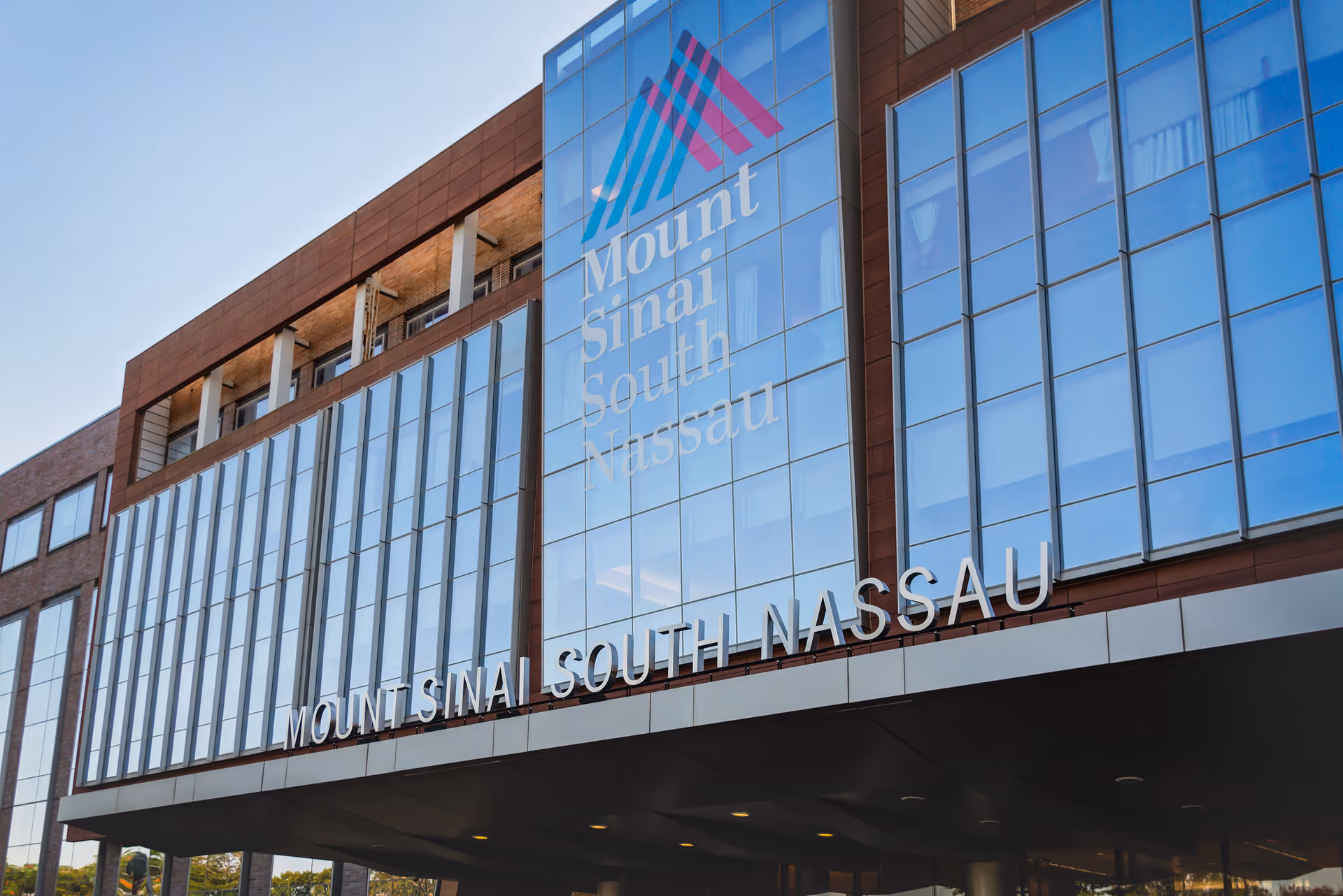 Exterior view of a modern hospital building with Mount Sinai South Nassau signage.