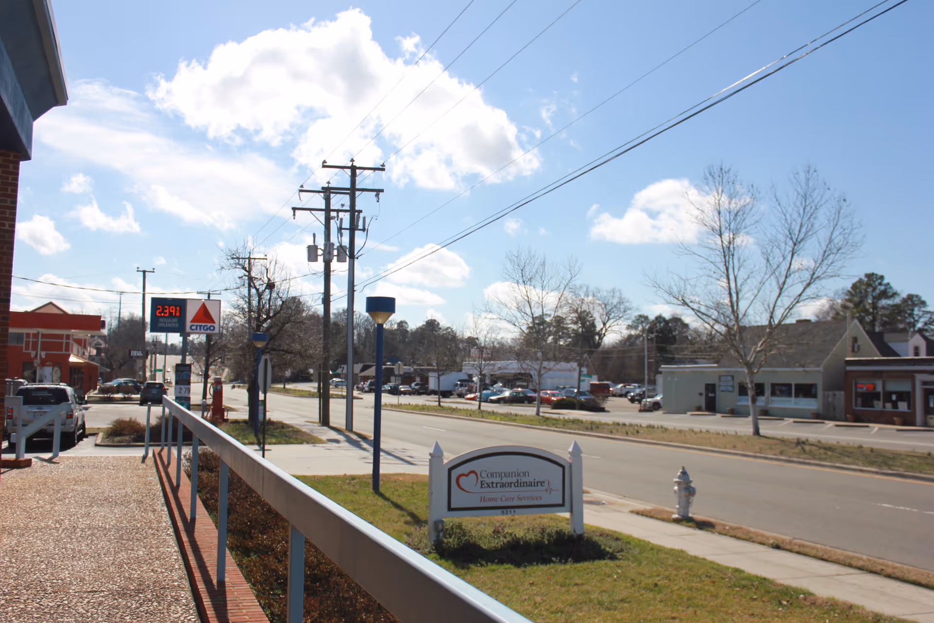 Street view of the Companion Extraordinaire Home Care Services exterior with a sidewalk sign.