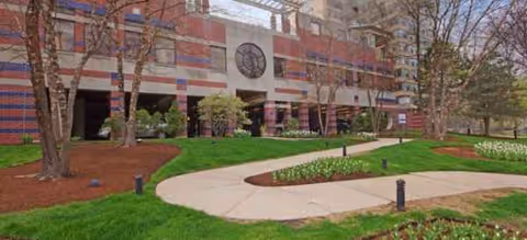 Exterior view of Brookdale Lake Shore Drive with landscaped lawn and curved sidewalk