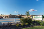 Exterior view of Willowbend Healthcare and Rehabilitation building with sign and landscaping.