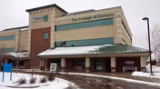 Exterior view of a multi-story senior living facility named The Cottage of Davison with a covered entrance and a snow-covered ground.