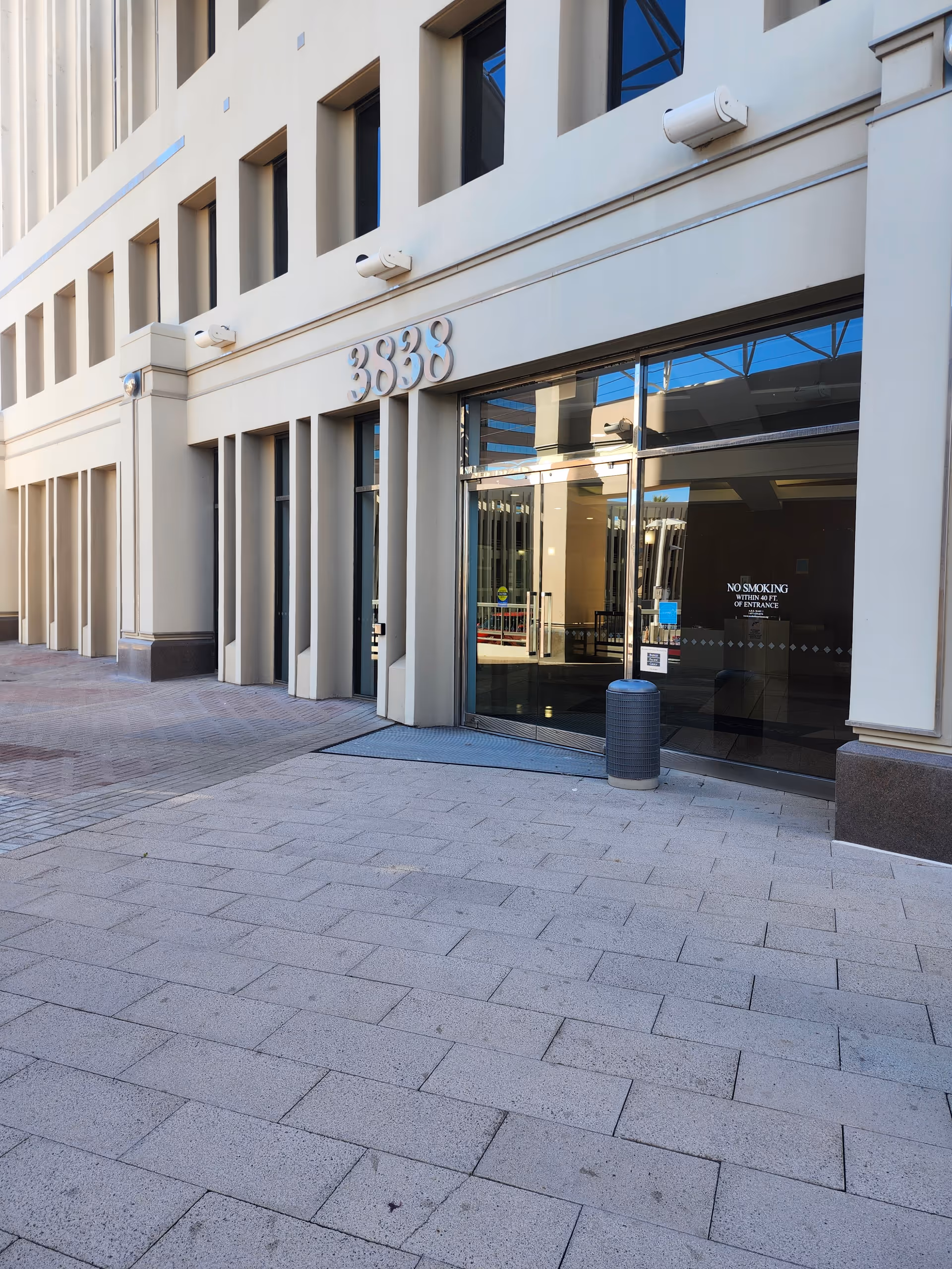 Exterior view of Anchors Homecare LLC entrance with glass doors and address 3838.