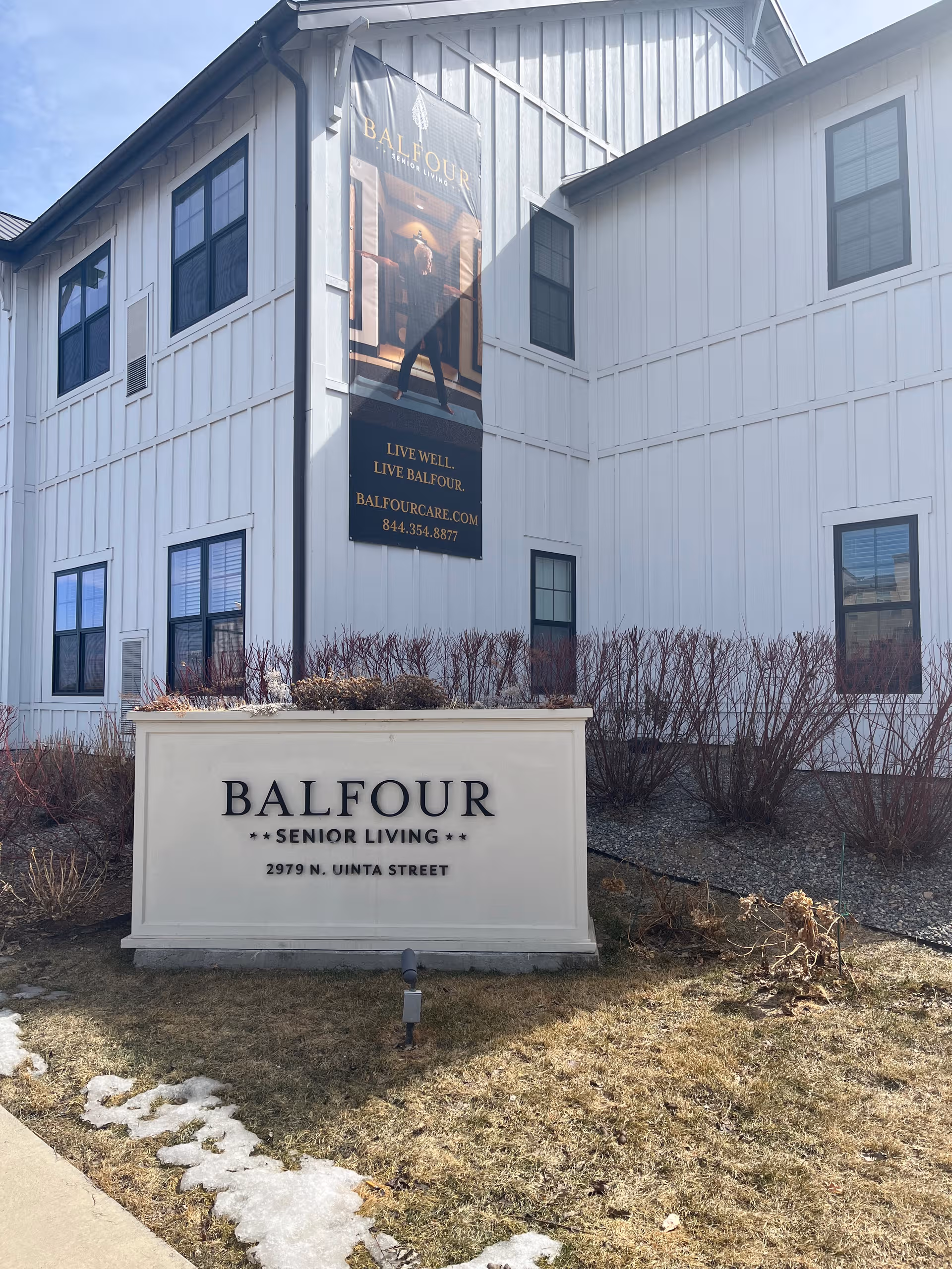 Exterior view of Balfour Senior Living building with front sign.