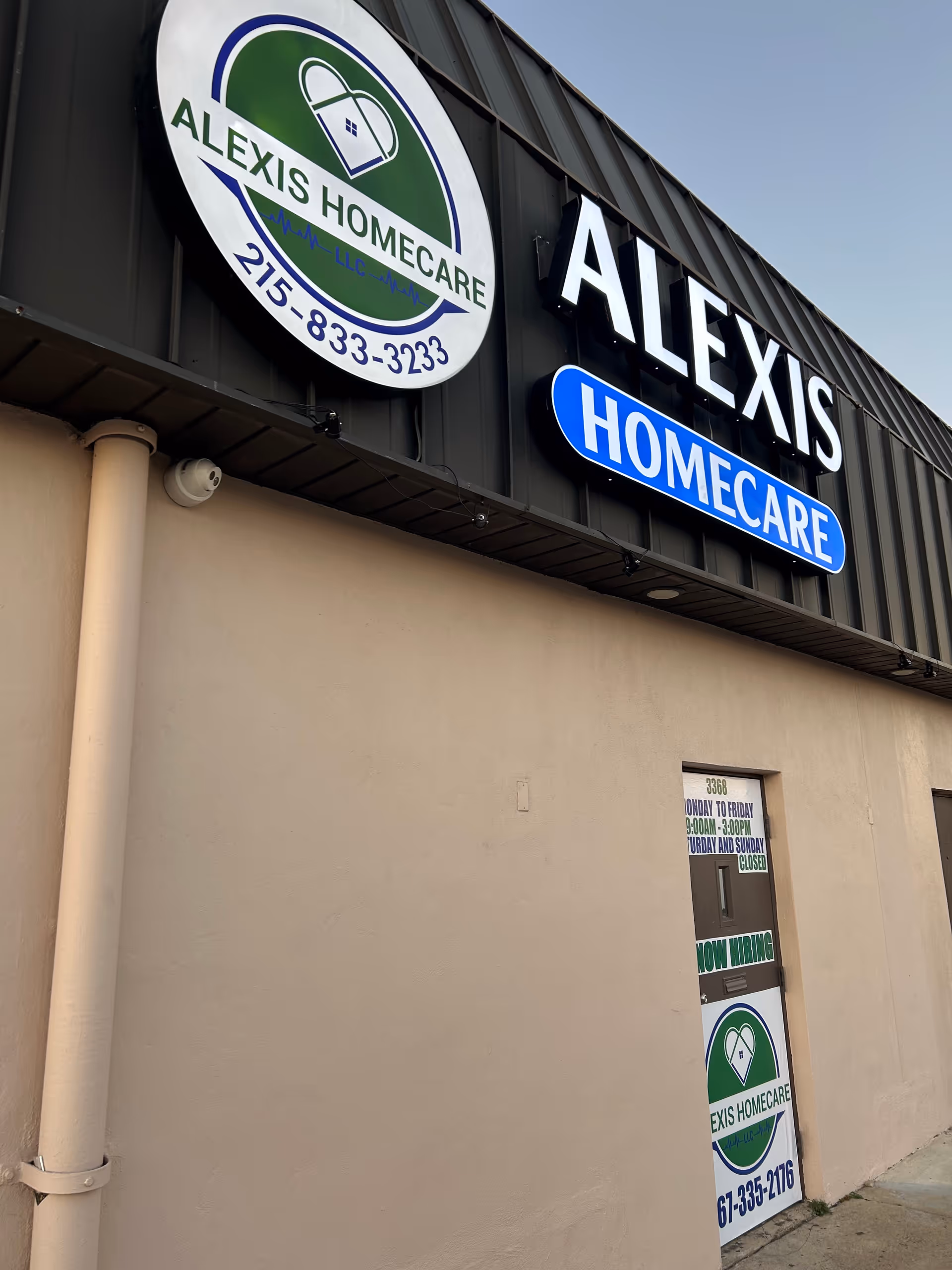 Exterior view of Alexis Homecare signs and building front with entrance.